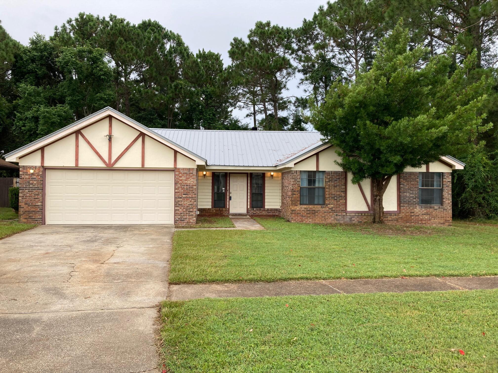 NEW METAL ROOF in 07/2021, NEW stove/oven going in 07/2021, NEW A/C in 2021, NEW dishwasher in 2021!!!3/2 Brick home just 5 miles West of Hurlburt tucked into the back of the popular Chateau Estates neighborhood. Property has a wooded preserve to the rear and side for extra privacy. Oversized living room with cathedral ceilings & exposed wood beams, a nice brick wood burning fireplace and solid bamboo wood floors throughout. This great family home includes a large florida room overlooking the backyard that is full of windows allowing lots of natural light to pour in. Large backyard is just waiting for you to enjoy this fall. The 3 bedrooms and 2 baths are located on the right wing of the house giving it a great layout. Lawn pump and sprinkler system as is.