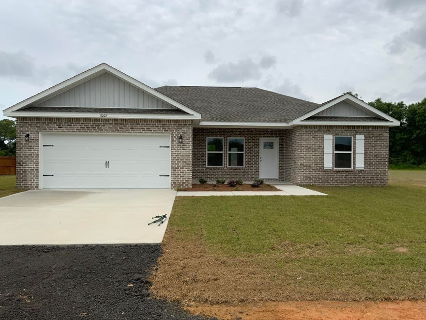 MIGHTY BIG LOT (1+ ACRE) FOR THIS SMALL Craftsman Style Home in BAKER!  Beautiful new all brick home with some of the bells and whistles in larger homes-RAISED CEILINGS with Recessed lighting, LUXURY VINYL PLANK FLOORING in common areas, QUARTZ OR GRANITE countertops in kitchen and baths.  Kitchen has pantry, work island, white shaker style cabinets, kitchen island with bar seating, double vanities in owners bath + walk-in closet.  Large laundry room and 2-car garage. HURRICANE PROTECTION FABRIC SHIELD FOR ALL WINDOWS! Home under construction-MARCH COMPLETION DATE, seller will help with closing costs (restrictions apply).  Photos are of similar completed home, colors and front elevation will vary.