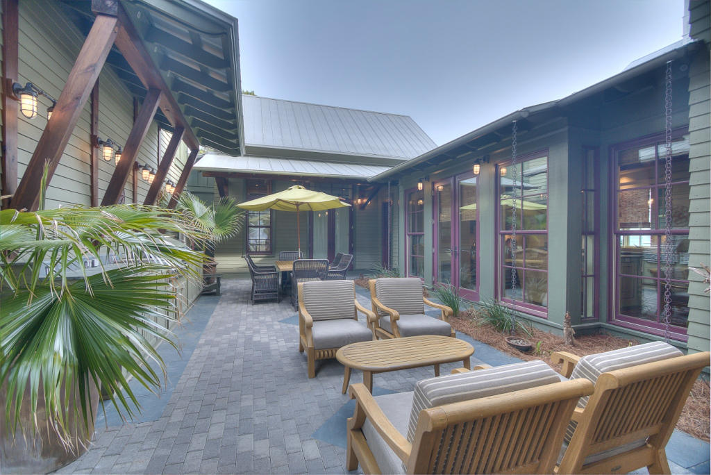 Enjoy 2nd floor lake views from this beautifully appointed WaterColor retreat located one lot away from Western Lake. The main house offers three bedrooms, three and half bathrooms and a bunk room with four built-in bunks for ample space for family and friends to gather. A cozy carriage house over the garage offers an additional bedroom with full bathroom. The gourmet kitchen boasts quartz granite countertops, a stone backsplash, copper sinks, Wolf gas range, wet bar and wine refrigerator. A beautiful courtyard complete with summer kitchen provides the perfect backdrop for lazy summer evenings after a full day spent at the beach. Additional home features include a first floor master suite with private screened porch, hardwood floors throughout, crown molding and tile and granite bathrooms.