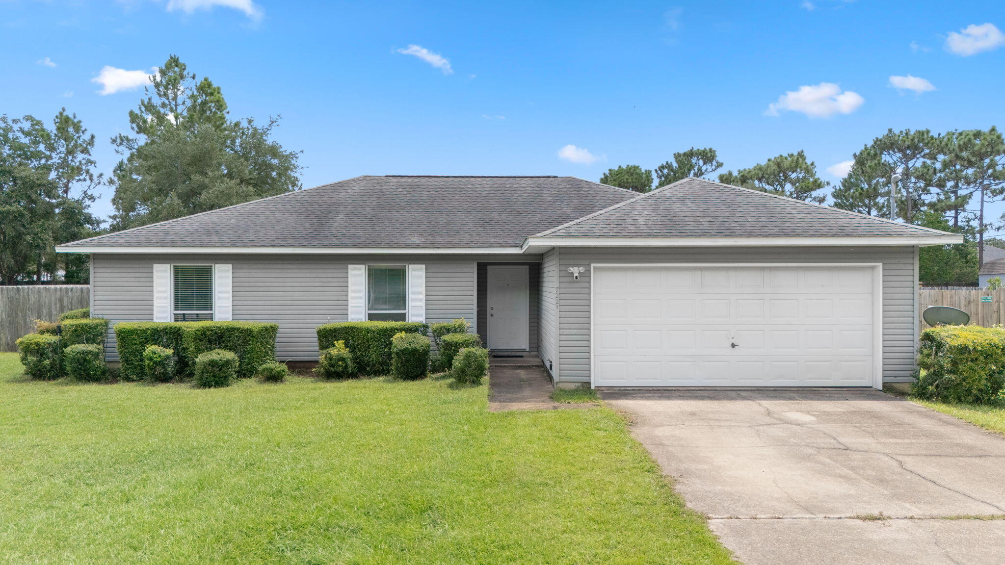 A Charming First Home with Space, Style & Amenities GaloreNestled in a quiet, well-maintained community, this adorable 3-bedroom, 2-bathroom home is the perfect opportunity for a first-time homebuyer or a small family looking to plant roots. With curb appeal that shines, this home sits proudly on a fully fenced half-acre lot, offering plenty of space for pets, gardening, and outdoor fun--plus privacy you'll appreciate.Newly vacant and move-in ready, this home makes your transition smooth and stress-free. No waiting, no delays--just pack your bags and start your next chapter with ease.From the moment you arrive, you'll notice the well-manicured lawn and thoughtful landscaping that make this home feel warm and welcoming. Inside, the layout is functional and cozy, with room to grow. Natural light pours through the windows, highlighting each space's charm and comfort. The two full bathrooms make mornings and evenings a breeze, and each of the three bedrooms offers generous closet space and versatility.
One of the biggest bonuses? The seller is taking care of a brand new roof prior to closing, offering you peace of mind and potentially lower homeowners insurance premiums for years to come. The home also runs on a septic system, keeping utility costs manageable. This home also features a brand new HVAC system!
Beyond the front door, you'll love what the affordable HOA brings to the table:
Resort-style community pool
Tennis courts and fitness areas for active living
A well-equipped gym and relaxing steam room
Boat launch access, perfect for weekend water adventures
...and so much more to enjoy year-round.
Whether you're enjoying your private backyard, unwinding at the community amenities, or looking ahead to a future with low maintenance and high enjoyment, this home checks all the boxes.
Affordable. Lovable. Move-in ready. Come see for yourself and fall in love.