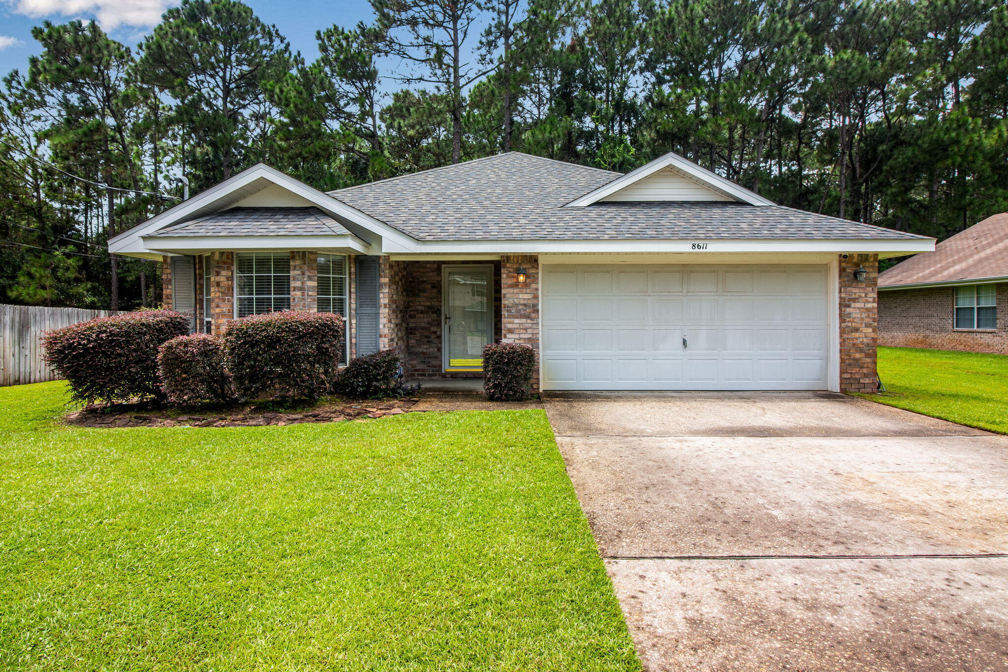 Located in the highly desired city of Navarre, this traditional ranch-style home combines comfort, convenience, and coastal charm. Just off Hwy 87, you'll enjoy quick access to the pristine Emerald Coast beaches, shopping, dining, and nearby military bases.This well-maintained home offers a bright and airy feel throughout, with freshly cleaned carpets and a seamless floor plan perfect for everyday living. Step outside to the back patio and take in the serenity and privacy provided by the wooded backdrop--an ideal space for relaxing or entertaining.
