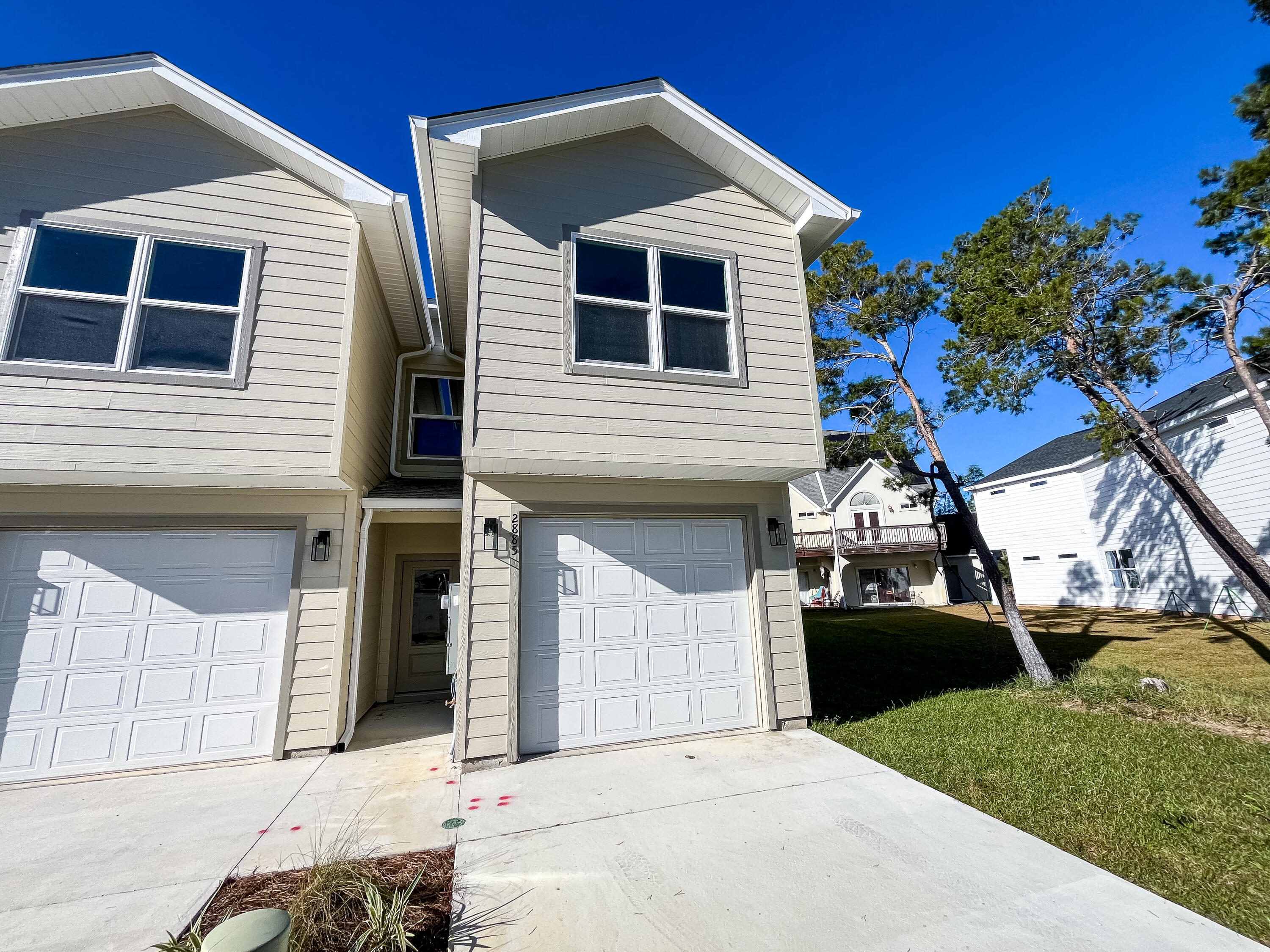 **Move-in Special: 1st month rent free** Stunning new construction 5-bedroom, 3.5-bathroom townhome in Hidden Bay Village. This two-story home features an open-concept living area with high ceilings, large windows, and a door to the backyard with a full length glass panel, filling the space with natural light. The kitchen boasts upgraded appliances, granite countertops, and more.There are two primary suites: one on the first floor with an ensuite bathroom, perfect for convenience and accessibility, and another luxurious primary suite on the second floor with a walk-in closet, dual vanities, a soaking tub, and a separate shower boasting two shower heads. Three additional bedrooms provide ample space for family or a home office.