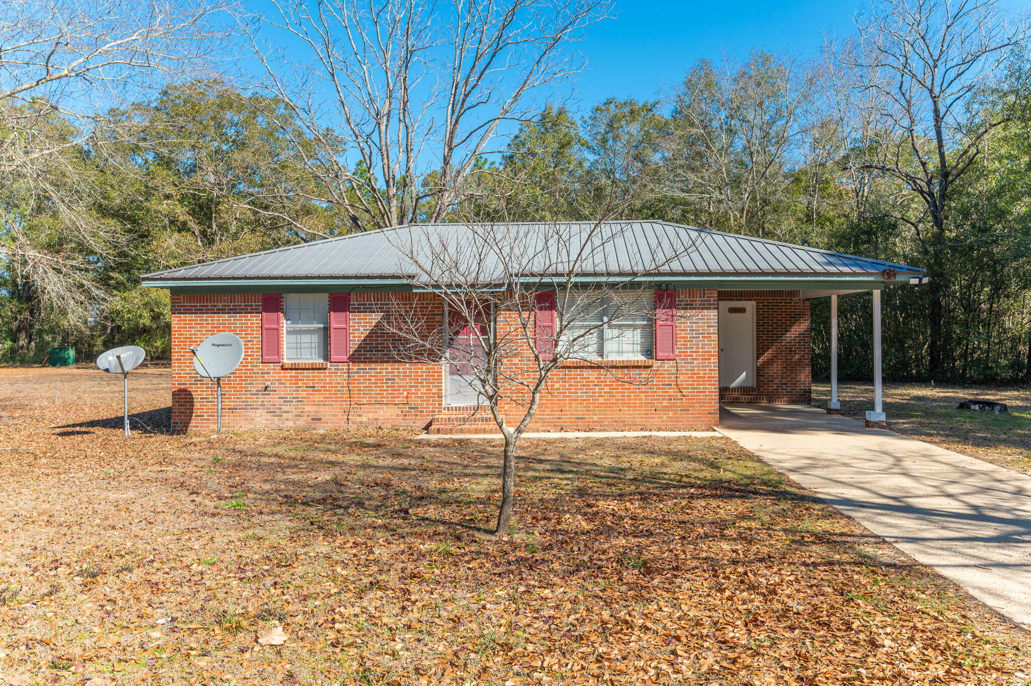 Situated on a spacious 1.136-acre lot in historic DeFuniak Springs, this charming brick home blends timeless appeal with modern updates. Featuring two bedrooms and a well-designed bathroom, it offers comfort and style with elegant LVP flooring throughout. A convenient storage shed simplifies organization, enhancing the property's functionality. Enjoy tranquility away from city hustle, while still having easy access to amenities and major roads. If you are seeking a serene escape, this home's character and potential make it a must-see. Requirements are 600 credit score, household income of $3750 and one year on the job. Application is required with background and credit check.