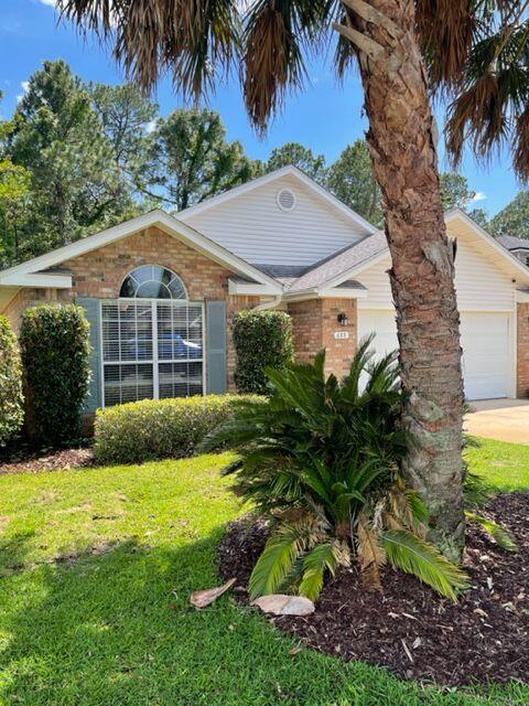 Beautiful home in Emerald Village.  Three bedrooms with an additional office with french doors. Granite counters in kitchen and baths.  Newly painted. New carpet in bedrooms.  The rest of the house is tiled.  Formal dining area in addition to an eat-in kitchen with built in benches  Updated lighting throughout.  Roof 2015 with solar panels that are paid off.  Save on your monthly power bills! Sellers say average power bill is $35 a month!  Newer windows.  Triple sliding doors expand the living space to a tiled 3 season Florida room.   This home has it all and is waiting for you!