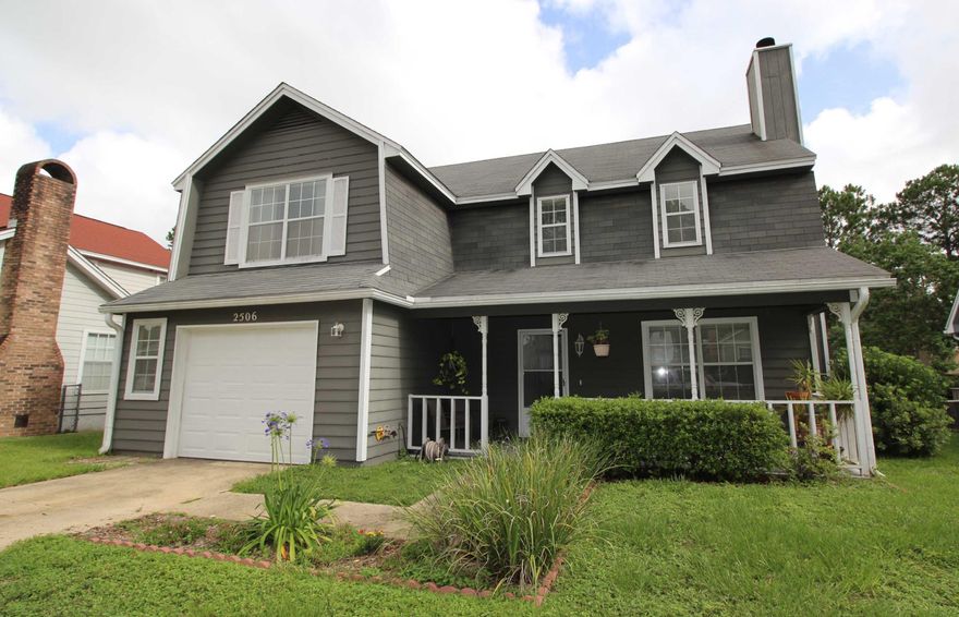 FEELS LIKE COUNTRY LIVING WITHOUT THE DRIVE! Great curb appeal complete with a large covered front porch. Spacious living room with a picture window and fireplace with custom mantle and accent mirror. Formal dining area opens into the living area with water views of the lake. Light and bright kitchen with a breakfast area with a Pella sliding glass door that leads out to the open deck overlooking the lake making it the perfect place to relax and grill out. Half bath and laundry area conveniently located downstairs. Large master bedroom with plenty of room for a sitting area and a huge walk-in closet. Master bath has an extended vanity with a make-up station. Two additional good size bedrooms and a large hall bath. New 50 gallon energy saver water heater and roof installed in 2010.