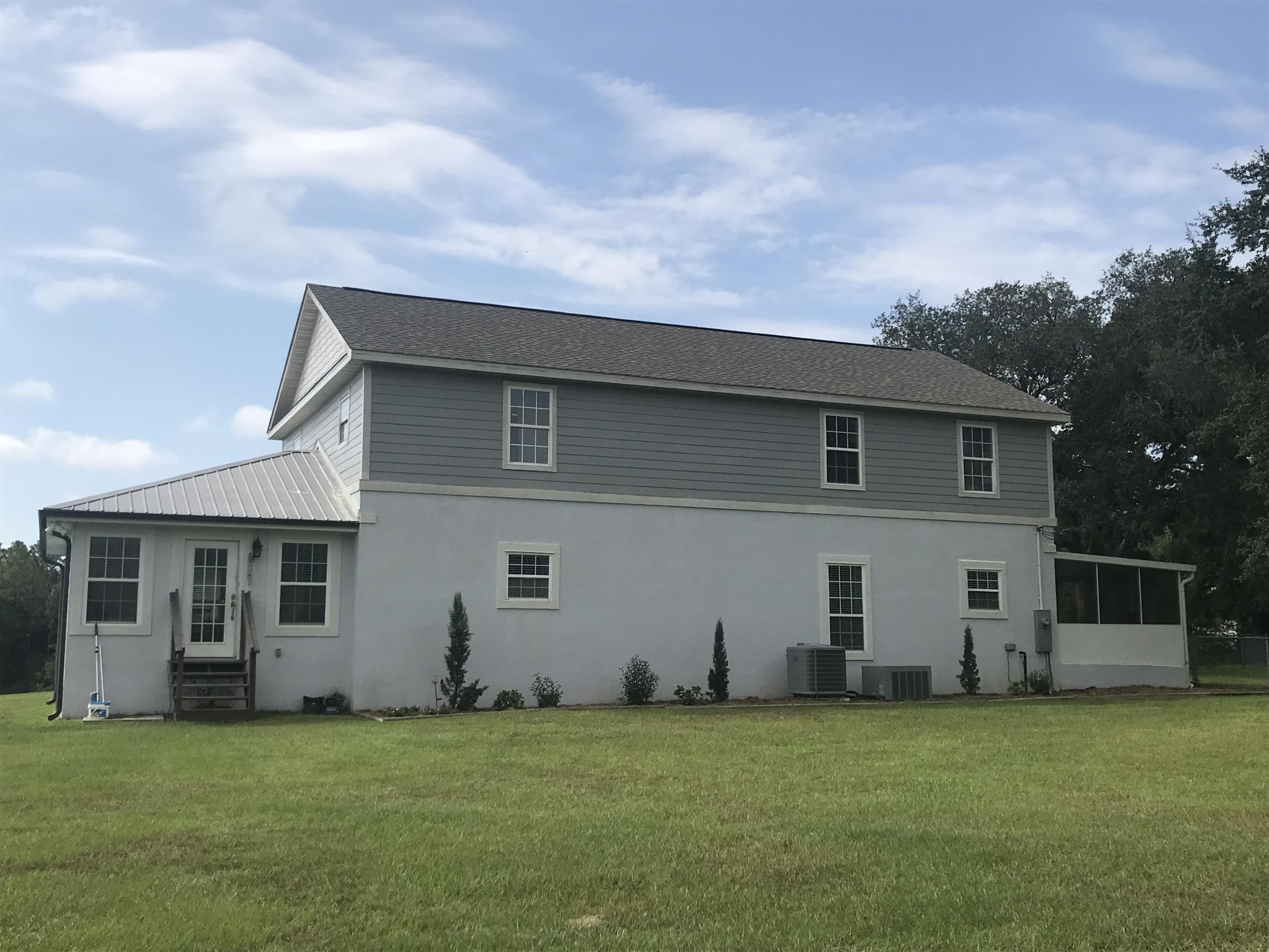 Rare find!!! This large beautiful home offers over 800' of lake frontage on 19 acres and only 10 min from town. 2 spring fed stocked lakes on property and has access and borders a 3rd lake Enjoy beautiful views throughout the home. There is a large conditioned Florida room on the front and a large screened in porch on the back. Owner has taken great care of the home and it is move in ready. The upstairs only needs flooring, painting, and a few little things and it will be ready as well. It offers an additional living room, large laundry room, large bonus room, bathroom with jacuzzi tub, and 2 additional bedrooms. In 2016 the owners installed a new A/C, a new roof, renovated the entire first floor, and insulated home with spray foam. Home has so much to offer! Call for showing today