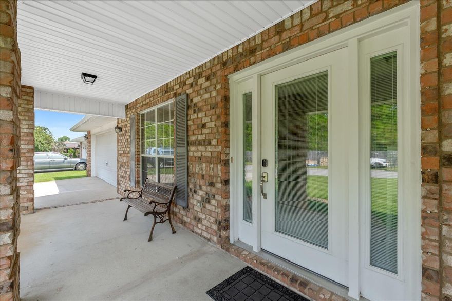 Motivated Sellers! This all-brick, single-story residence with 5 spacious bedrooms and 3 full baths, is designed to accommodate both family living and entertaining with ease. As you step inside, you are greeted by an open foyer area that seamlessly flows into the kitchen and the living area. Features premium LPV flooring adding warmth and durability. The kitchen is a chef's delight, complete with stainless steel appliances, granite countertops with lots of space andcabinetry, making meal preparation a breeze. An island offers additional seating, perfect for casual dining or gathering with friends and family. Off the kitchen is a separate dining room providing a space for special occasions, and entertainment.  Solar Panels offer a 65%+ savings on electric. All of the 5 bedrooms and 3 baths are generously sized.   This ALL-BRICK home not only offers timeless curb appeal but also promises durability and minimal maintenance. The single-story layout makes it perfect for families of all ages. Located in a desirable neighborhood, it combines the best of both worlds, peaceful, private living with proximity to beaches, shopping, dining, and top-rated schools. Don't miss the opportunity to make this beautiful, move-in-ready home yours!