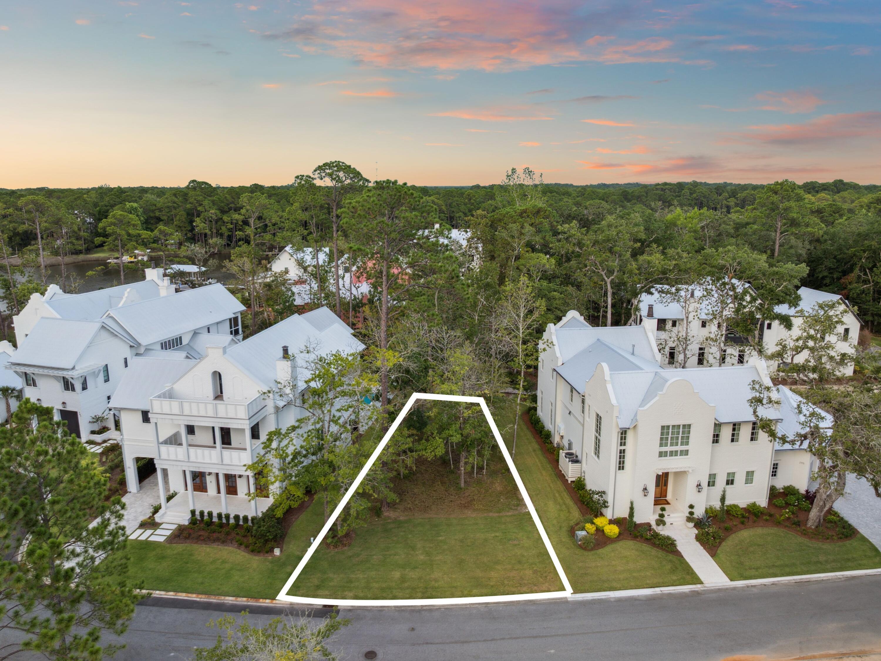 Situated near the heart of the Churchill Oaks community, Lot 82 offers a rare opportunity to build your custom home just steps from the neighborhood's premier amenities. This spacious homesite backs up to the scenic boardwalk that wraps around the neighborhood, offering peaceful views and easy access to nature right from your backyard. Located just a short stroll from the clubhouse, Lot 82 is ideally positioned for enjoying everything Churchill Oaks has to offer. The clubhouse features a resort-style pool, a state-of-the-art fitness center, and walking trails that meander through lush, landscaped grounds. Residents also enjoy access to a deep-water marina with private boat slips, paddleboard storage, and a fish cleaning station.
With its boardwalk setting and close proximity to the community hub, Lot 82 is a prime opportunity to create your ideal coastal retreat in one of Santa Rosa Beach's most prestigious neighborhoods.