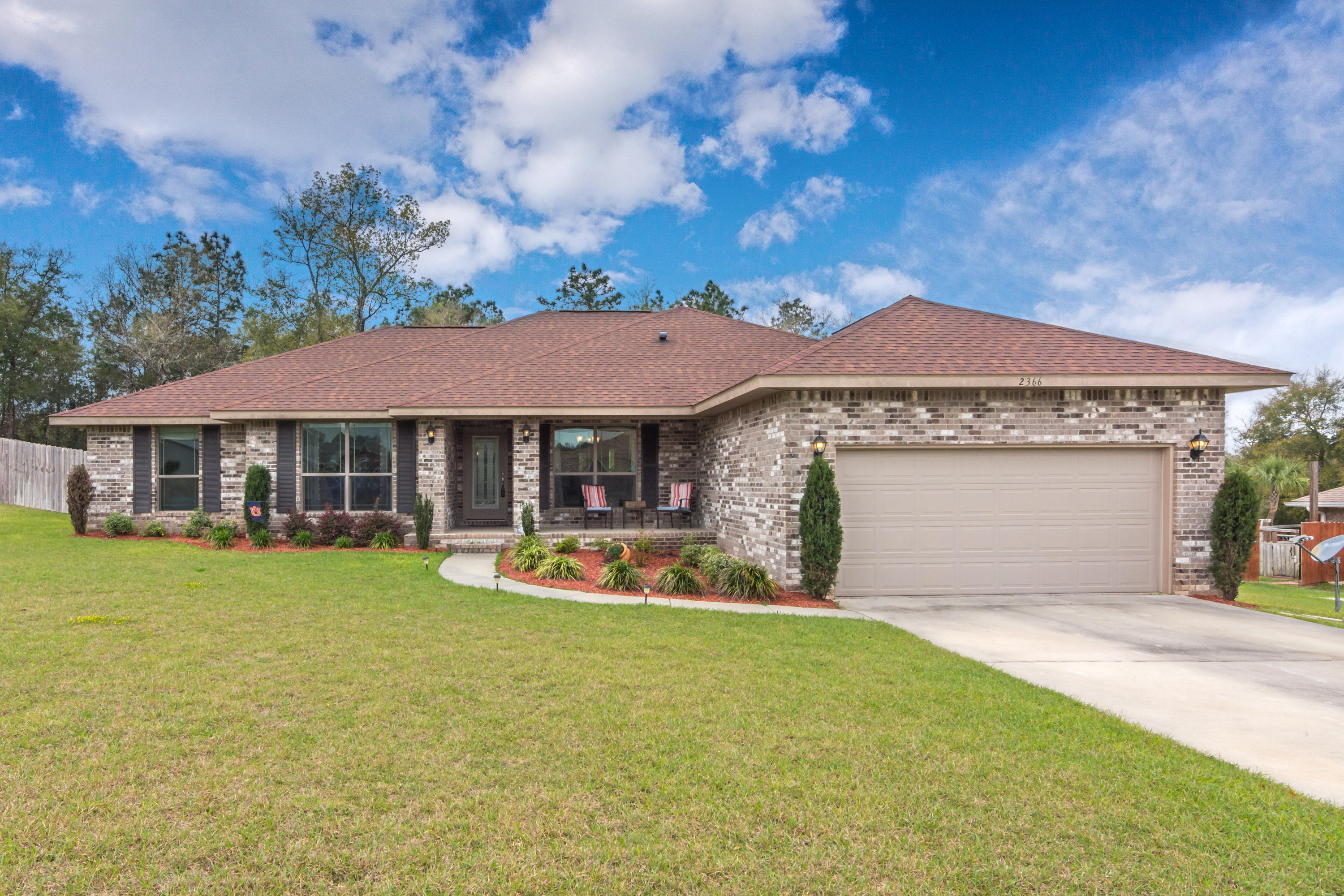 Looks like new construction! This well cared for 2014 home is 4bd/2ba with office and formal dining. Large living room with fireplace to entertain, overlooks eat in kitchen with large granite breakfast bar, stainless steel appliances. The master suite is oversized and bathroom features dual vanities, large soaking tub with separate shower, and his and her closets. Not only do you have the perfect front porch for all your decor, but a screened in back porch to overlook a HUGE, level backyard. Home sits on a half acre well manicured yard.