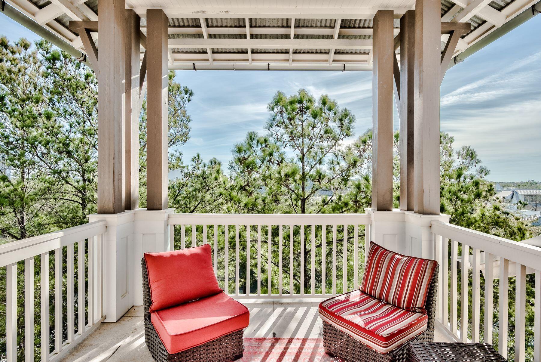 Overlooking the sprawling green space in the heart of north Rosemary Beach, this four-story townhome embodies the coastal atmosphere that has lured home buyers to the community for decades. One of only seven attached single family properties in the bustling new-urbanism community, this rare property provides both northern and southern views, ample outdoor living spaces, and the quintessential luxury amenities expected along iconic 30A.Spacious parking and a charming raised patio is offered at the rear entrance on this home, also providing ample space for the addition of a private pool and sunning deck if desired. The first level of the property is home to two bedrooms, a wet bar, and a reading nook. An elevator provides easy access to the second and third floors, offering one additional