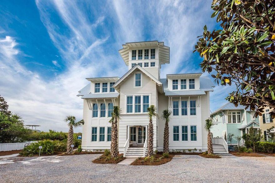 Home is completed and ready to move in! Exquisite, one-of-a-kind new construction WaterColor home located south of Scenic Highway 30A! Designed by Stackable + Squires, developed by Cummings Development, LLC and built by Daniel Cole, this incredible coastal retreat features a reverse floor plan with elevator to maximize enjoyment of gulf views, an enclosed heated saltwater swimming pool and a 4th floor cupola with breathtaking panoramic gulf and community views. The home's design comfortably hosts large groups with 4,478 square feet, 5 bedrooms, 5.5 bathrooms and spacious living and media rooms. Special finishes such as wire brushed stained oak hardwood floors and 8 v grove walls add character and charm while details such as an upgraded corrugated metal roof, HVAC 18 seer zoned system and weather shield window reflect the top-notch quality of construction. The first story includes 2 guest rooms with ensuite bathrooms, a bunkroom and the indoor saltwater swimming pool while the 2nd floor houses an amazing master suite, a separate sitting room and an additional guest room with private bath. The third floor features a gourmet kitchen with large island and banquette seating, a media room, an expansive living room and an additional built-in bunkroom.  Located on 499 acres in the renowned South Walton Beaches, the picturesque WaterColor community was created with families in mind and offers the charm of small town life. Exceptional community amenities include several beautiful swimming pools, a gulf front beach club, nature trails, kayaking, canoeing, a fitness center, tennis, Camp WaterColor for kids, parks and green spaces.