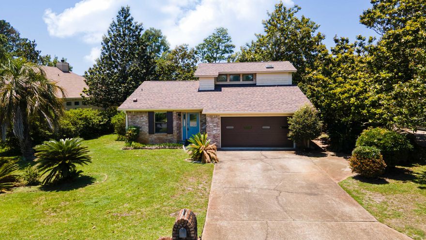 Located on Perdido Bay Golf Course, all brick 2 story home waiting for you to add your personal style! This 3 bed, 2 bath home features an open concept living area with a beautiful brick wood burning fireplace as the focal point for your family to gather around. The home has great natural lighting throughout and has excellent potential to be a showstopper. The roof is new, HVAC & A/C is also new. The back yard is lush and private perfect for entertaining and backs up on to the 4th hole of the golf course which provides a lake view. 2 car garage provides plenty of storage.