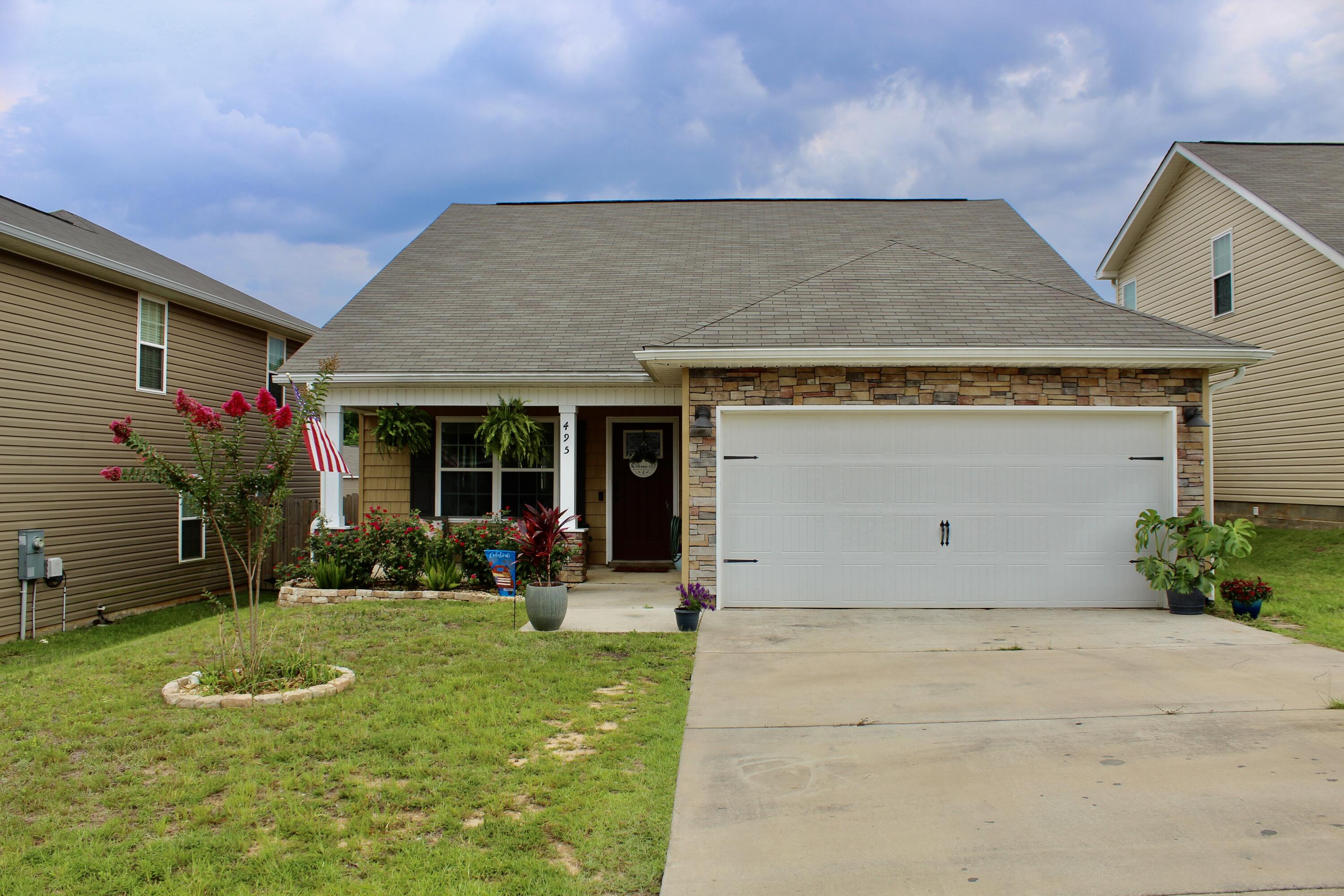 We have a 2 story home with 4 bedrooms, 2.5 baths located in Stilwell Estates. This 2-story home offers a living room, dining room, kitchen with breakfast bar, pantry, half bath and master suite with dual vanities with a walk in closet and separate shower and tub downstairs. There is a bonus area upstairs along with 3 bedrooms and a full bath. All kitchen appliances are stainless steel, and you also have a laundry room with access to a two-car garage. This floor plan feels larger than its actual square footage, so you'll have plenty of room for your family or entertaining guests. The backyard is fully fenced in and has a built-in fire pit