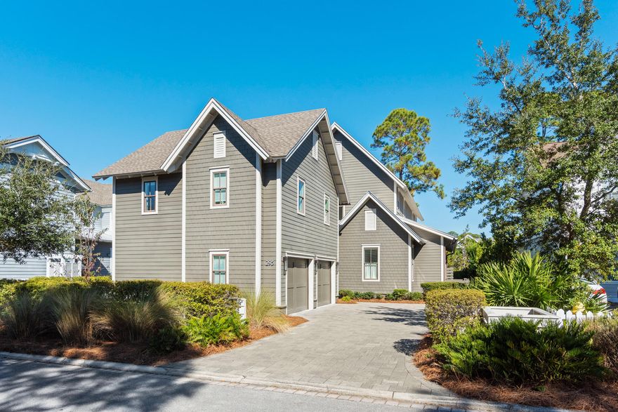 Located on the south side of the lake, this beautifully modern home boasts one of the most sought after locations in Watersound West Beach.  The appealing floor plan features a very spacious and open living space that flows effortlessly through the kitchen and dining area as well as two lovely screened porches. The screened porch on the back of the home is peaceful and very private and adjoins a patio with a fire pit. The living room boasts a gas fireplace and the well appointed sophisticated  kitchen includes a gas cooktop, ice maker, two dishwasher drawers, and a generous quartz island with seating for six. This home is perfect for entertaining family and friends!  The lovely master suite is located on the main level and features a spacious walk-in closet.