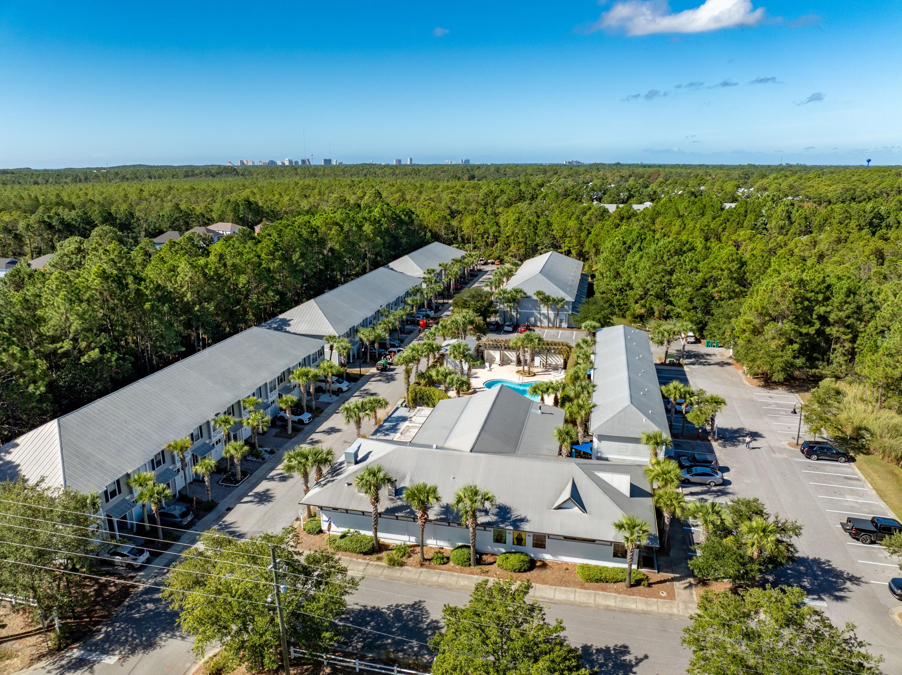 Newly renovated townhome in lovely Eagle Bay neighborhood. Onsite restaurant, close to Bay access and minutes from the pristine beaches along 30A, Topsail State Park, and nearby shopping at Grand Boulevard and Walmart, Sacred Heart, etc.  Perfect for outdoor enthusiasts, the property offers a tranquil retreat where you can bike, kayak, paddleboard, or enjoy a swim in the bay. This home is filled with updates and charming features, including curved walls, a freshly remodeled kitchen with granite countertops, white cabinetry, and stainless steel appliances. The bathrooms have been updated with stylish vanities, a beautiful walk-in shower, and granite counters. Upstairs, durable LVP flooring enhances the fresh, newly painted interior and new fixtures.