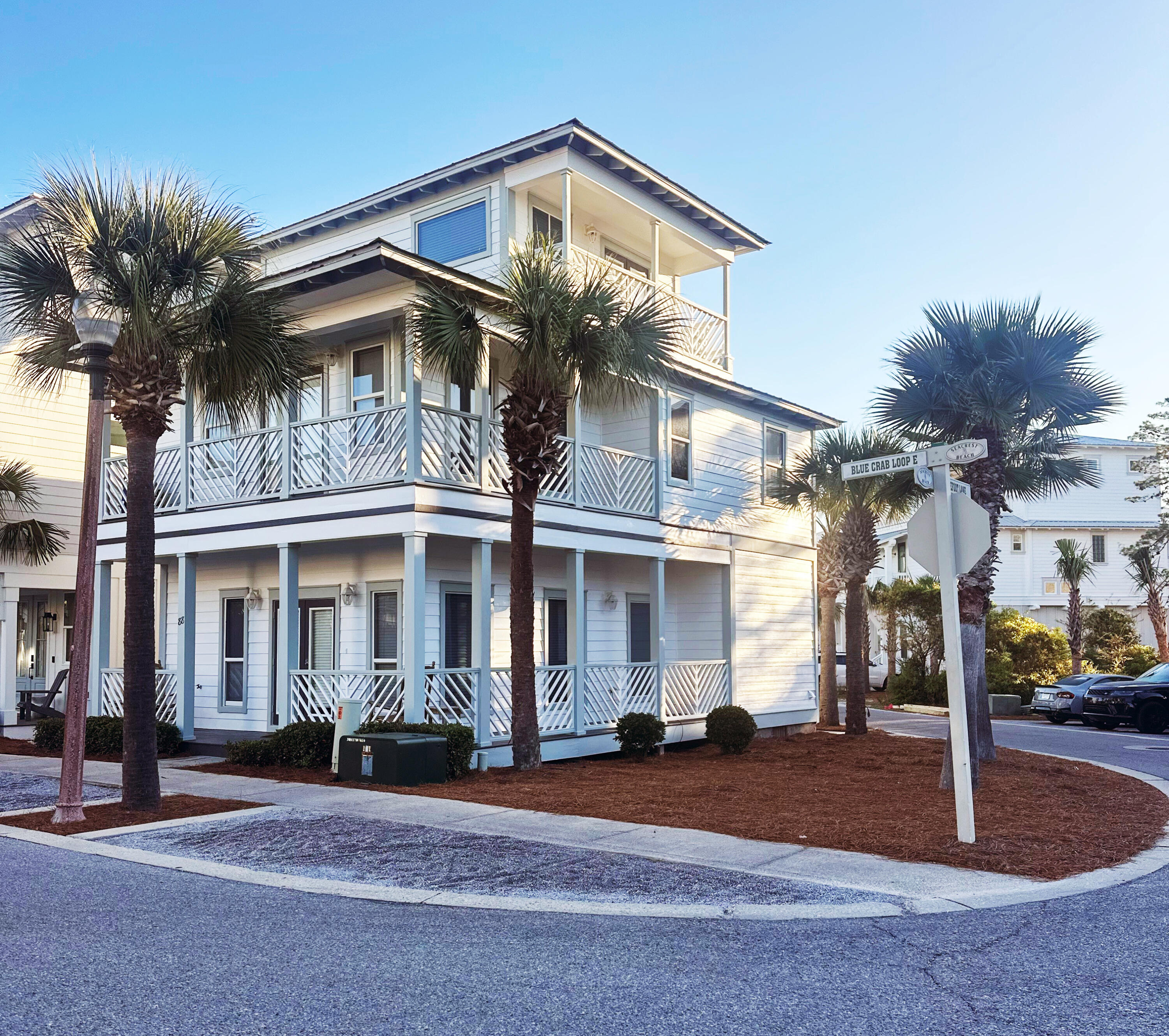 Situated in a prime corner location, this home is an idyllic setting for a beach getaway. This home exudes Florida elegance, communicated through beautiful finishes, superb craftsmanship and decadent amenities. Moving through the home's first level includes a sun-splashed living room, a nice kitchen with gorgeous countertops, white appliances, plus adjoining dining area. You will find one bedroom plus a bathroom and washer/dryer conveniently located. The second floor has an expansive master suite with an ensuite bathroom, two additional bedrooms, and porches galore. Move on up to the third floor where you will find the final bonus area/bedroom with a full bathroom and gorgeous views from the oversized covered balcony.