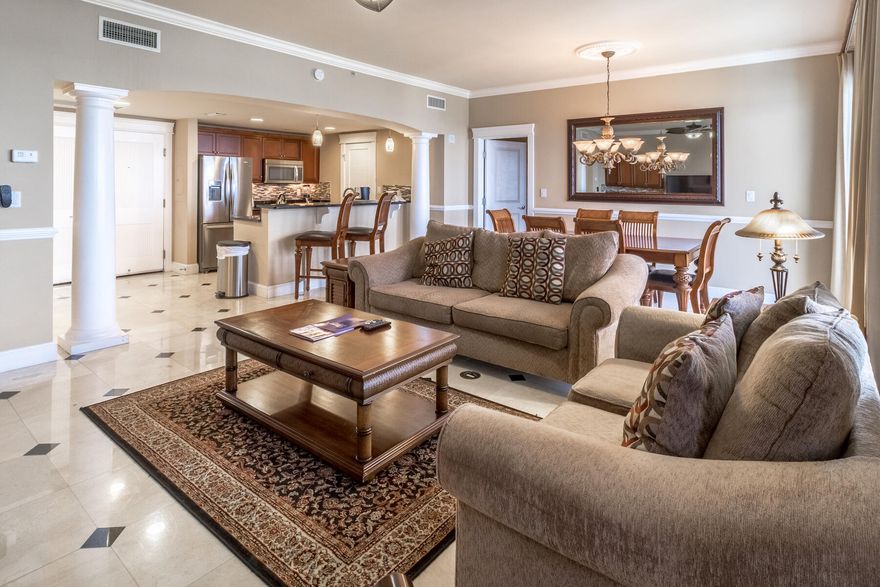 FULLY FURNISHED & ALL UTILITIES INCLUDED AVAILABLE SEPTEMBER 1ST! This incredible 3-bedroom, 3-bath condo boasts just under 1,800 sq ft & offers sweeping views of the Choctawhatchee Bay, Sandestin Marina, and the beautiful grounds of Grand Sandestin from the 9th floor. The balcony faces west which means you'll enjoy breathtaking sunsets over the bay! As soon as you enter this luxurious condo through the solid wood double doors, you immediately notice the amazing bay views as well as notable features such as travertine tile floors with inlay design, elegant columns, Whirlpool stainless steel appliances, mahogany custom cabinetry, granite countertops, and tile backsplash. The spacious open floor concept is ideal for hosting with a wet bar off the living area, room for 6 at the dining table,