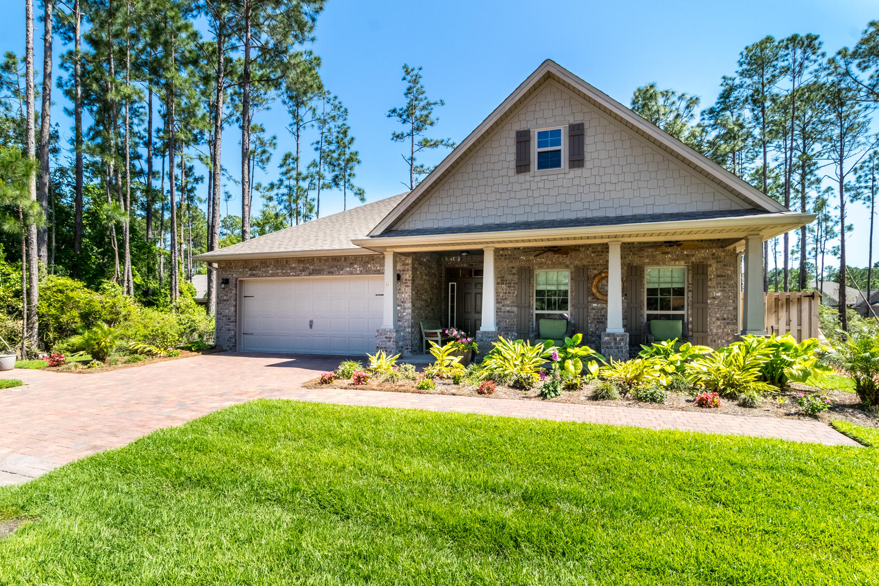 Call to see this beautiful one story brick home - short notice is okay! Far beyond builder standards with wood flooring (no carpet), custom gutters, lawn and garden irrigation, privacy fenced yard, paver patio and sidewalk, extra crown molding and a paneled 2 car garage ! The spacious, open floor plan offers a terrific layout for daily living and entertaining. Warm yet neutral, the kitchen with off white cabinetry, tile backsplash, granite counters, and stainless appliances flows naturally to the family room and dining area. A large master suite with walk in shower and walk in closet features a bright sitting area and direct access to the covered, screened porch. Convenient location to schools, boat ramps, beach and a short walk to N Eden pocket park on Choctawhatchee Bay.