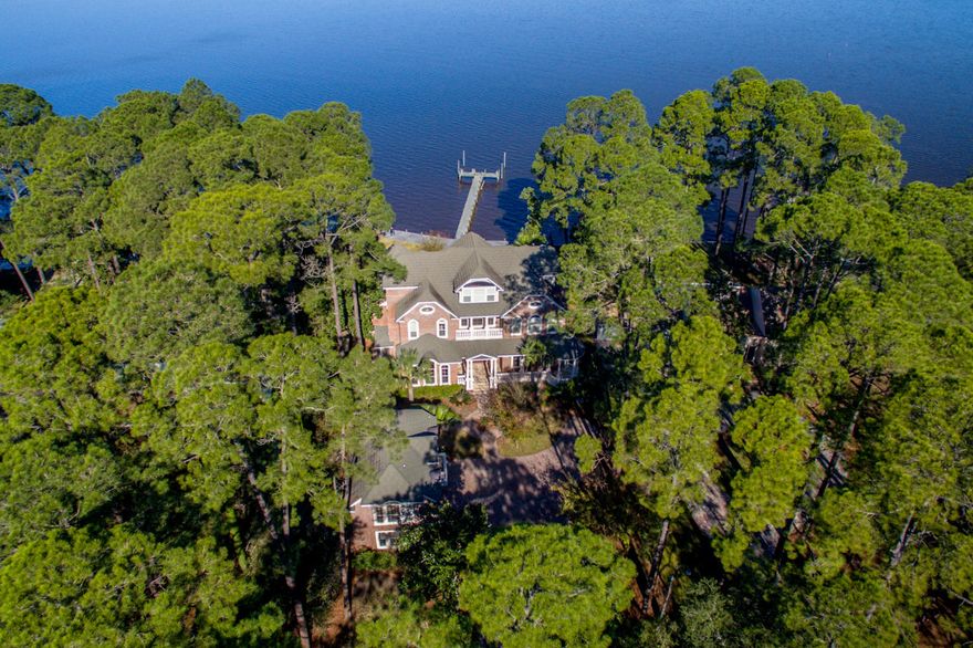 **PRICE JUST SHARPLY REDUCED**BANK-OWNED** This beautiful property includes an elegant 3-story main home, which combines gracious traditional and Southern design elements with comfort and convenience; a 3-car garage with carriage home; and a large, private lot on the Choctawhatchee Bay.The first floor includes a grand entrance, formal living room/parlor and beautiful formal dining room with a modern kitchen and attached family room. Highlights of the kitchen include large granite island, high-end stainless appliances, and custom cabinetry with abundant storage. The luxurious master wing and an exquisite formal office with separate entrance are also located on the first floor.An elevator joins all 3 floors, as does a rich Rosewood staircase with wainscoting...