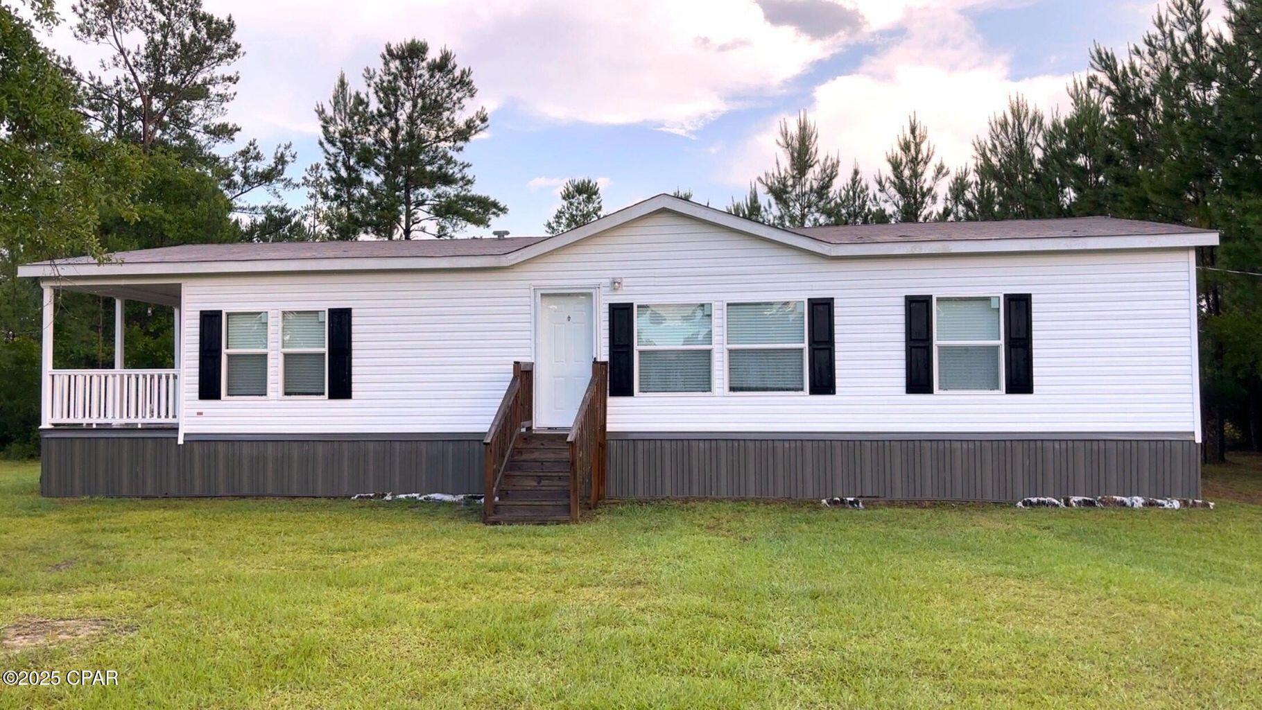 2020 Manufactured home located on almost 18 acres of land on paved road w/easy access to Hwy 231! This home features a beautiful eat-in kitchen w/an island. An inside laundry room is just off the kitchen. The master bedroom has an en suite bathroom with a double sink vanity and a large shower. The additional bedrooms are nice sized and share the guest bathroom. Approximately 1/3 of the acreage is cleared. A chicken coop was installed on the property... There are two ponds w/one of them shared with the neighbor. The storage building is reminiscent of a small red barn. Numerous berry bushes are located throughout the property. Very private & beautiful homestead. Set up is available for additional residential structure. (All important details to be verified w/appropriate specialist).
