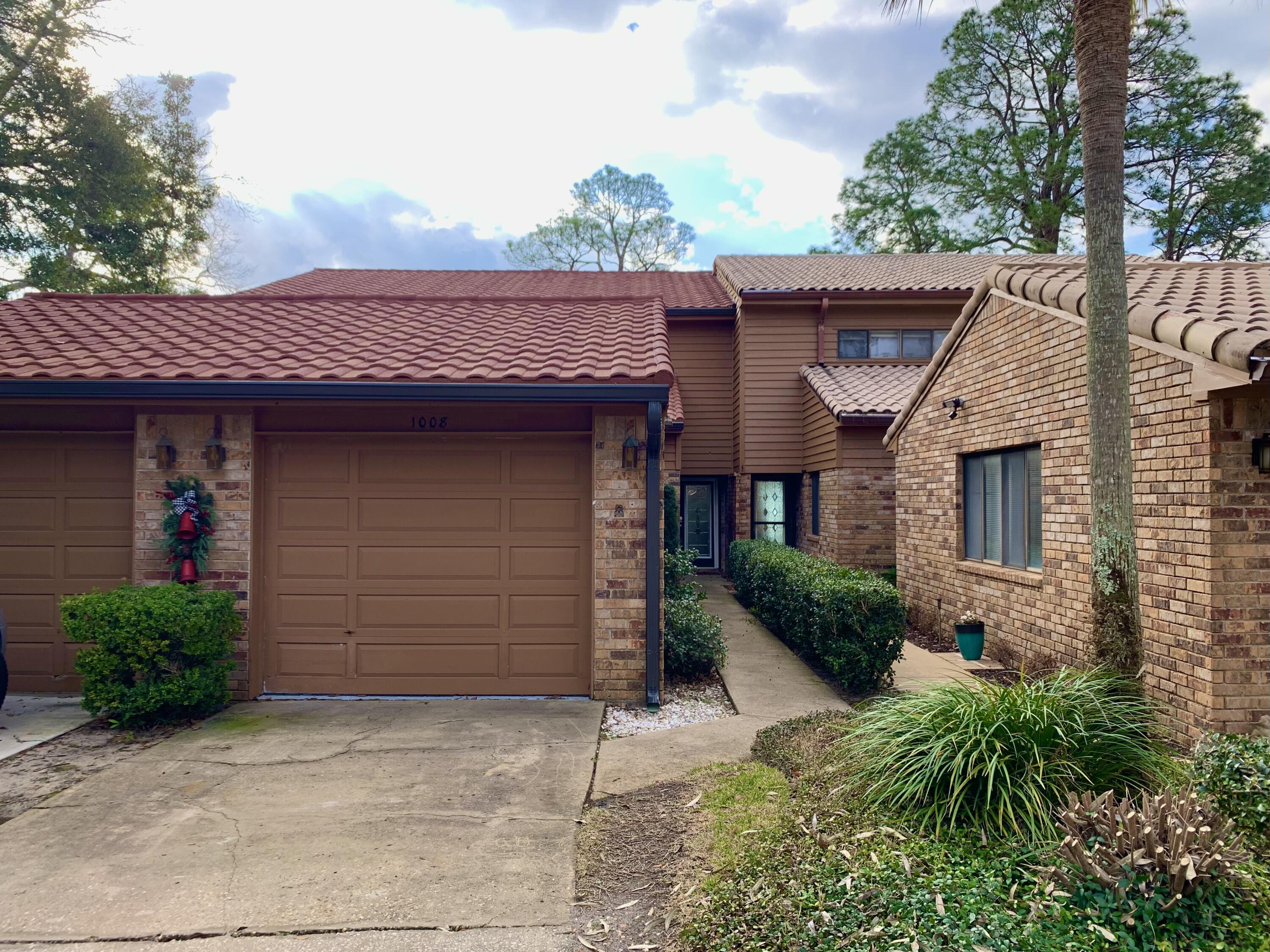 MILLION DOLLAR VIEWS OF BAYOU! This 3/3 townhome is in pristine condition! From the moment you walk through the leaded glass door you will be swept away by quality of this waterfront unit. Neutral colors throughout to suite any decor. Kitchen features stainless appliances (ice maker not warranted) and granite countertops. Main living area has gas fireplace flanked by beautiful built in's. Off the living area is the tiled Florida room with spectacular views of the Bayou. Outside you can enjoy the shared dock with your own boat lift and watching the dolphins play. One bedroom is on the main floor with two other spacious bedrooms upstairs. One bedroom features stunning views of the bayou. Unit even has a washer/dryer (not warranted). A single car garage finishes us this great unit.