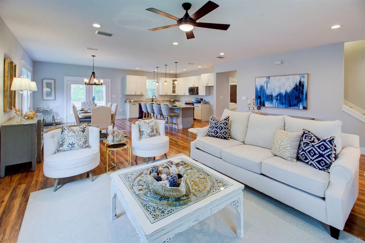 Views of the Bay are amazing from this 4 bedroom  CUSTOM home. As well as a 5 minute WALK to the Bay. With a fenced in backyard and views from every window. Located close to Sacred Heart Hospital and and Boulevard and very close to 30A. An easement to put your kayak or paddleboard is within walking distance. Over-sized porches,huge walk-in closets, walk-in pantry, large master shower and a huge family room as well. High end fixtures and windows like impact storm rated Jeld Wen windows, a two unit HVAC system by Rheem, spray foam insulation in attic, Smart Home Technology and beautiful upgraded kitchen cabinets.The yard is fenced in and has a  fire pit. perfect for a dog run.  Large enough to add a pool. A five minute walk to a dock to put your kayak or paddleboard