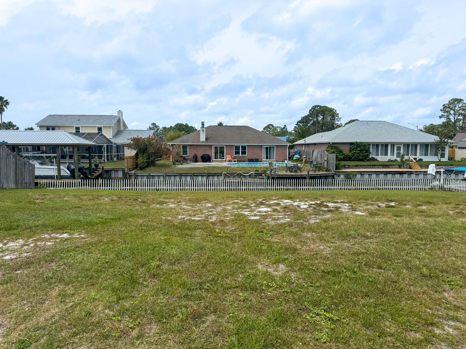 This 70 ft Waterfront Canel lot is nestled within the esteemed Polynesian Isles subdivision. The lot is Fenced, New Seawall is installed. You can purchase the land and construct your ideal home! Enjoy scenic views of the canal and proximity to pristine sugar white sand beaches, shopping amenities, and essential services. Positioned near Pensacola Beach and Fort Walton.