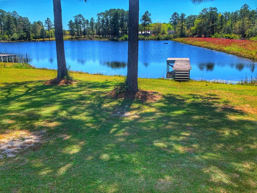 WATERFRONT! 3 bedroom 2 bath manufactured home. When entering the home you have a large living area with corner wood burning fireplace. The kitchen and dining area are off of the living room. The master bedroom and bath are very spacious. Walk-in closets in all bedrooms. There is a private dock on the property. 2 storage sheds that will convey with the home. All measurements must be verified by buyer.