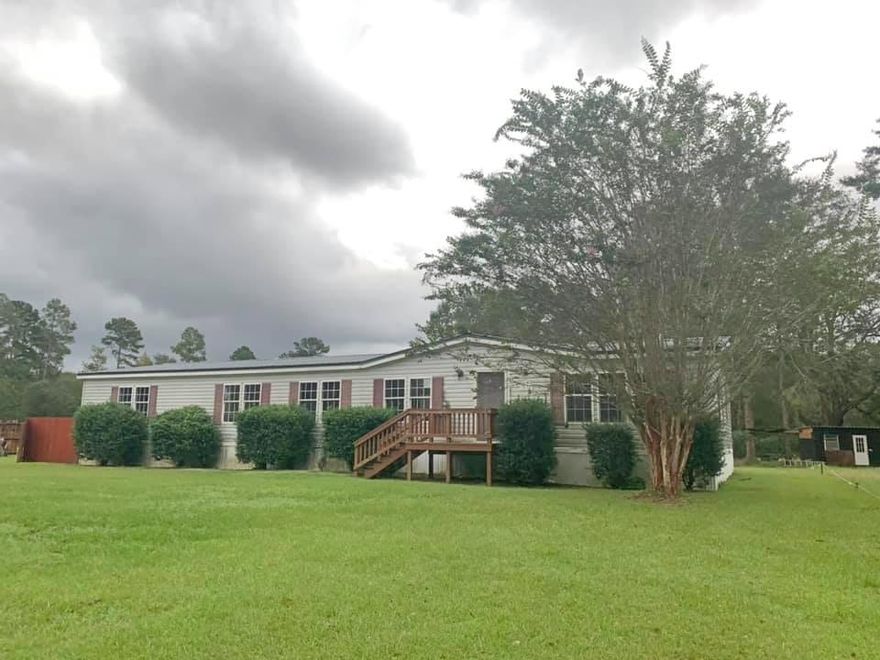 Check out this FORECLOSURE!!! Four bedroom, two bathroom, over 2000 sq ft on almost an acre with a detached garage! As soon as you walk in, you will realize that this floor plan used every square foot to it's advantage! The center of the home has a living room with fireplace, dining room and eat-in kitchen. The right side of the home is the master bedroom suite with en suite master bathroom which features a separate shower and garden tub, double sinks, and a huge walk-in closet! The split bedroom floor plan puts the rest of the bedrooms, additional full bathroom and utility room on the left side of this home! This home is ready  for your cosmetic touches and to be turned back into a home worth bragging about! Don't miss out!