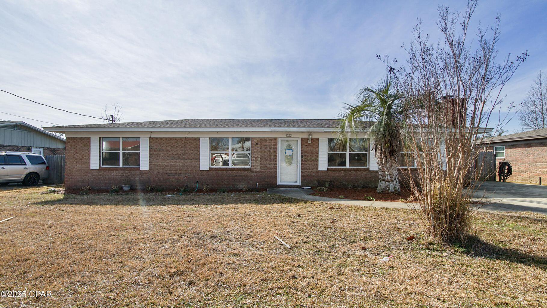 Completely Updated, Turn-Key Brick Home - 6522 Hiwassee Street, Panama City Welcome to 6522 Hiwassee Street, a stunning all-brick home that has been **completely updated and is truly move-in ready! This 3-bedroom, 2-bathroom gem offers modern upgrades, timeless charm, and an unbeatable location just minutes from Tyndall Air Force Base. Step inside to brand-new flooring and fresh interior paint, creating a bright and welcoming atmosphere. The spacious living room** features a cozy wood-burning fireplace, perfect for those cooler evenings. The updated kitchen boasts brand-new appliances and counter-tops, making meal prep a delight. Both bathrooms have been stylishly renovated, adding to the home's fresh and modern appeal . Outside, enjoy the newly landscaped yard and a fenced backyard with a fantastic deck, ideal for relaxing, entertaining, or hosting summer BBQs. With plenty of parking and ample space for your RV or boat, this property offers freedom and flexibility, all with NO HOA! Major upgrades include a brand-new HVAC system (inside and out)** and a new water heater, ensuring efficiency and peace of mind for years to come. =?? Owner financing is available - terms provided upon request! Don't miss this incredible opportunity to own a fully updated, turn-key home** in a prime location. Schedule your private showing today!