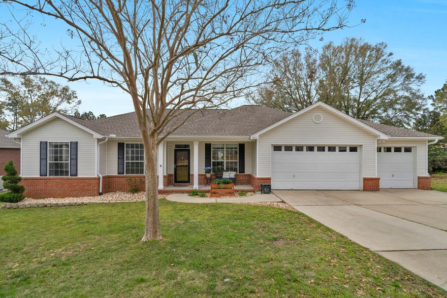 PRICE IMPROVEMENT!!!  Welcome home to the well-situated and maintained 4 bedroom 2 bath home on almost a third acre lot.  With large fenced in backyard, wood balcony overlooking lovely views, and concrete patio for outdoor enjoyment, this home is ideal for entertaining.  Featuring a 3 car garage with workshop area, great room with tray ceiling, formal dining room and oversized laundry room, this home offers a cozy environment with easy access to Duke Field, Eglin AFB, Destin beaches and is located south of I-10.  The rolling hills, mature trees, and views of the neighborhood lake give this subdivision a warm country feel.  Come take a look!