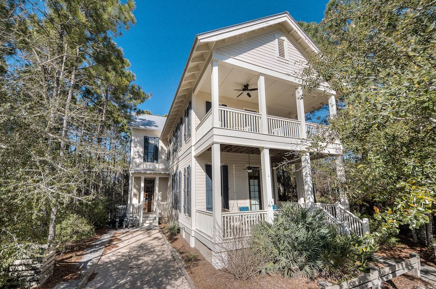 This gorgeous 4 bedroom, 4 bath home with room for a pool is a must see!! The 1st floor features 12ft ceilings, an open concept great room with gas fireplace, abundant windows & beautiful hardwood floors. The gourmet kitchen offers farmhouse sink and high end appliances. Luxury abounds in the 2nd floor master suite complete with a private porch and master bath featuring marble throughout, jetted tub and walk-in steam shower. Also on the second floor is a second living area with wet bar. This home features over 1300 SF of porches and is located on a quiet cul-de-sac with forest in the rear, lovely pond views to the side and a small park out front. Short stroll to Camp WaterColor, the tennis courts, the WaterColor Beach Club or many other communities many amenities.