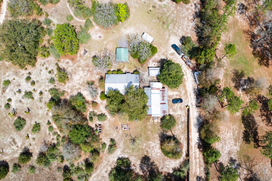 Showings to start on Tuesday February 27 - If you are looking for a charming home in the country sitting on 4.57 acres - then this is a must see.   It is a beautiful spot for your garden, chickens, horses and other pets.  This property is fully fenced and houses a multitude of wild animals including deer, foxes, gophers and all types of birds.   2010 Metal Roof, 2020 HVAC and tankless water heater.   Numerous outbuildings for storage a carport and a shop with the carport on the side.