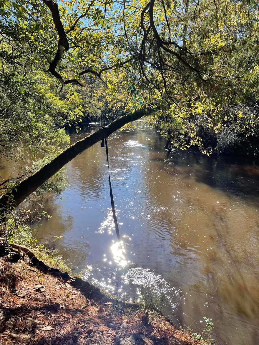 Riverfront lot. The perfect getaway lot on Shoal River! Cleared with a 24 x 31 pole barn, dock with steps.