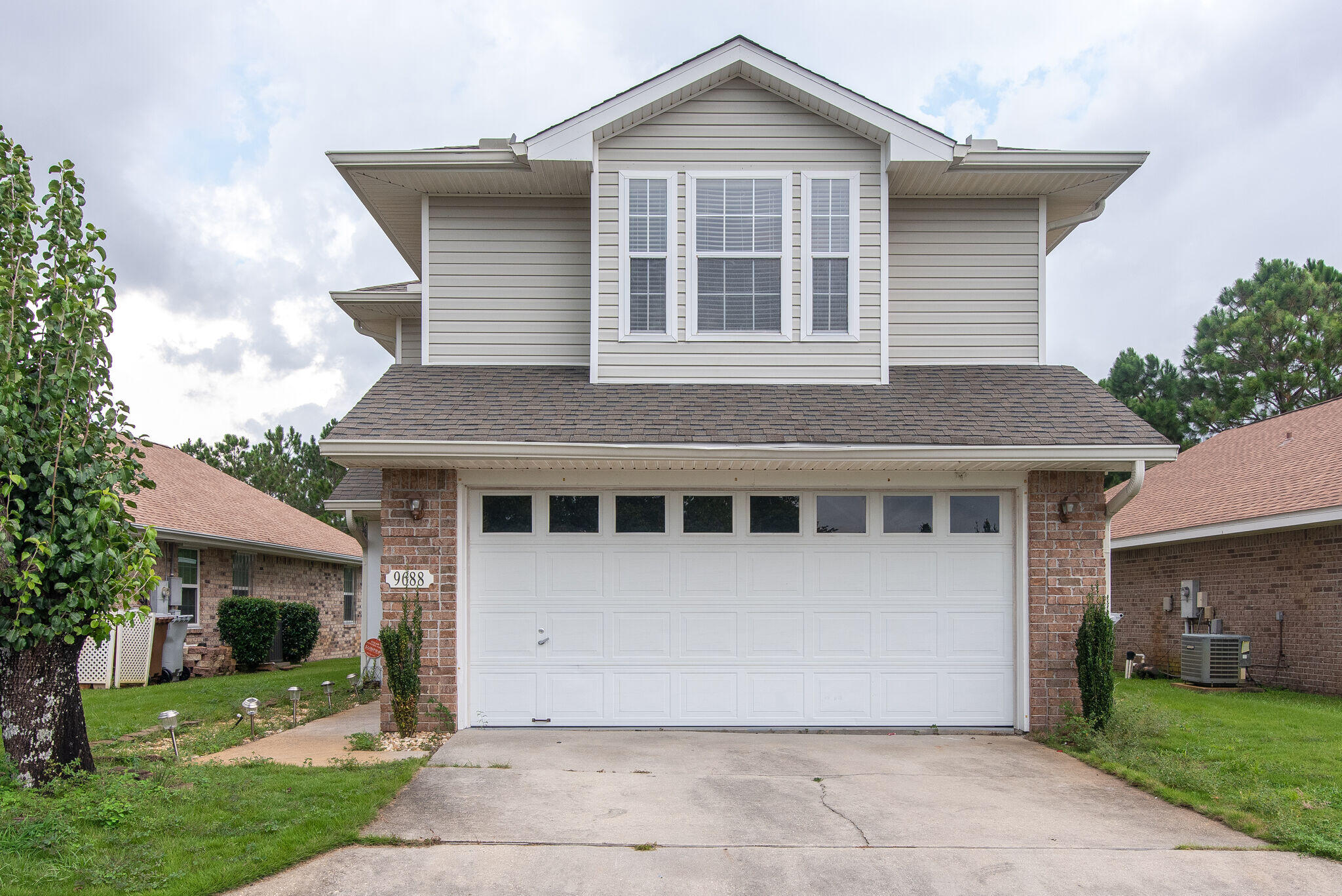Take a look at this adorable home in the Parker's Landing Community, directly across from the pool and situated with a beautiful water view and easy access to the walking path. On the first floor, the galley kitchen offers solid surface counters and stainless appliances, open to dining and living rooms, French door out to the covered patio overlooking the pond, extra 1/2 bathroom downstairs for guests. Upstairs are the master suite with walk-in closet and attached bathroom and two additional bedrooms with a shared full bathroom. This would be a perfect starter home or easy rental investment. Gated community with pool, sidewalks, pool, easy access to shopping, restaurants, and beaches!