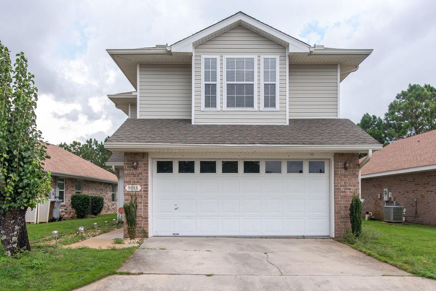 Take a look at this adorable home in the Parker's Landing Community, directly across from the pool and situated with a beautiful water view and easy access to the walking path.  On the first floor, the galley kitchen offers solid surface counters and stainless appliances, open to dining and living rooms, French door out to the covered patio overlooking the pond, extra 1/2 bathroom downstairs for guests.  Upstairs are the master suite with walk-in closet and attached bathroom and two additional bedrooms with a shared full bathroom. This would be a perfect starter home or easy rental investment.  Gated community with pool, sidewalks, pool, easy access to shopping, restaurants, and beaches!