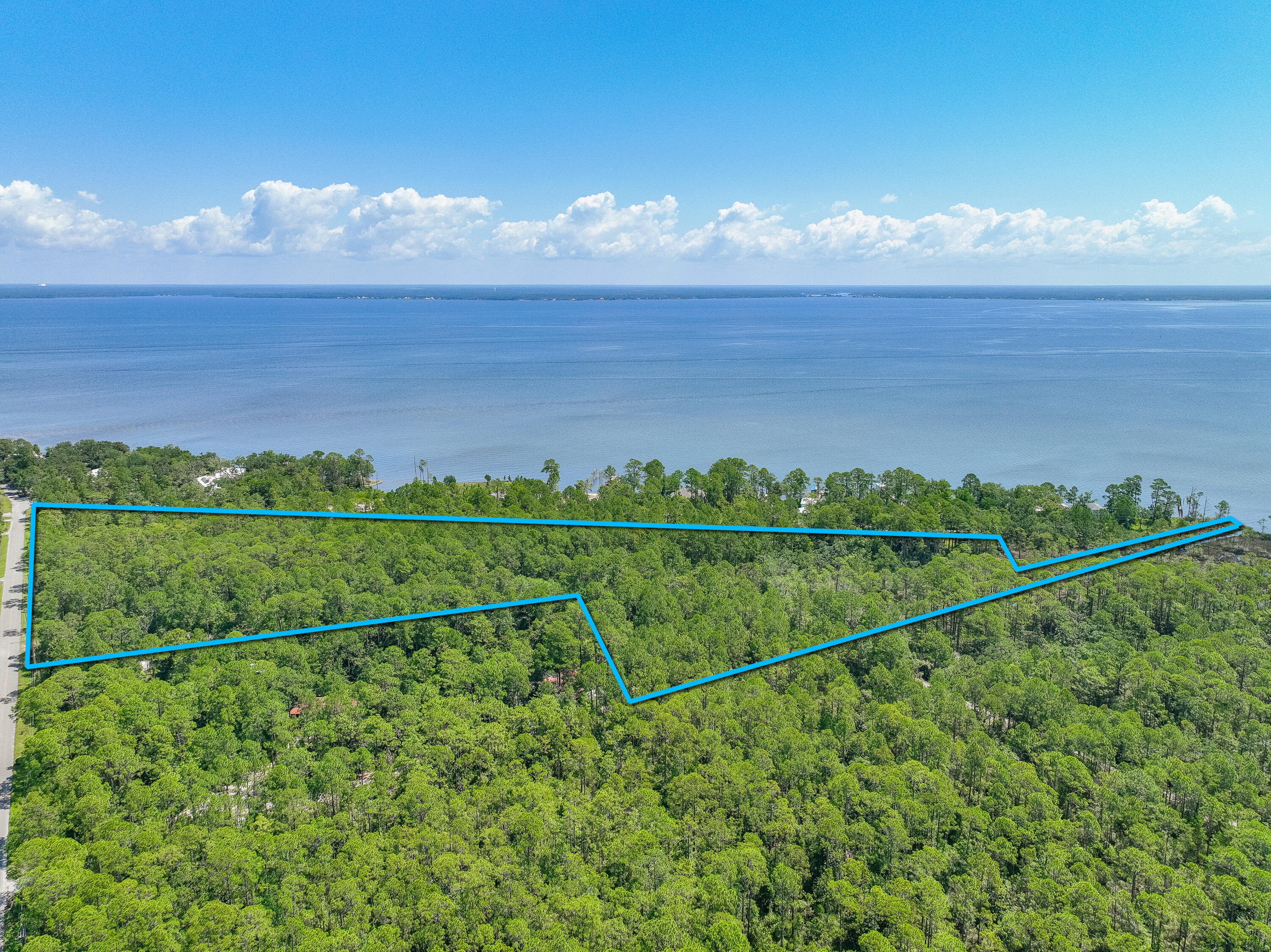 Don't pass up this SANCTUARY opportunity! 17+ Acres with Bay access!! This area is growing SO fast, properties of THIS size do not come often! Carve out a GIGANTIC homestead with room for everyone!! Or Create an exclusive minor development community with acres of preservation/nature trails, common area PLUS Bay access, as the east side of the property is Bay front, with many of the lots with possible bay views! All lots border existing improved road and this large lot has been left Florida Natural for you to design your own perfect paradise! A must see!