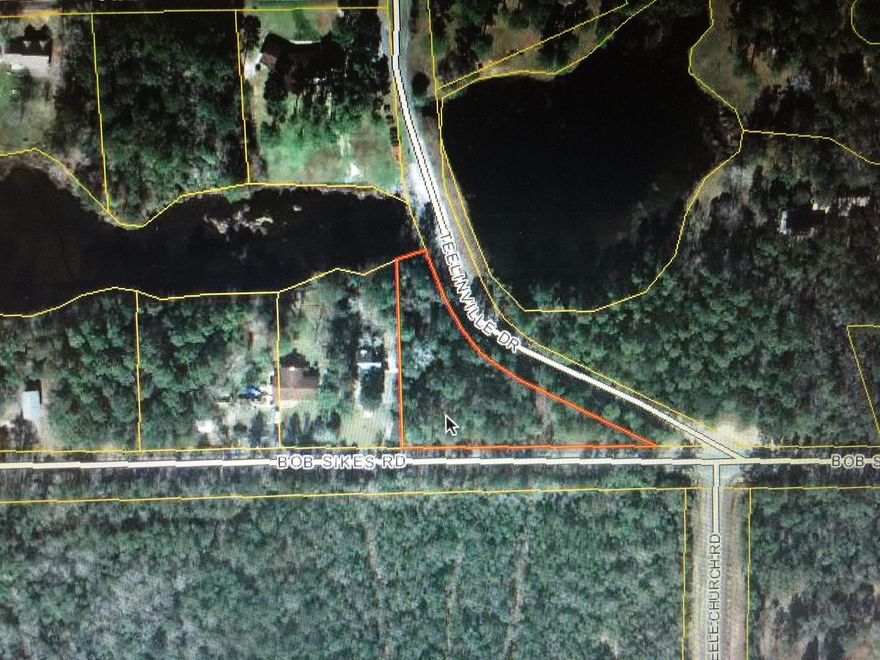 Corner lot with 40' (+) of lake frontage. Listing broker has ownership in the property.