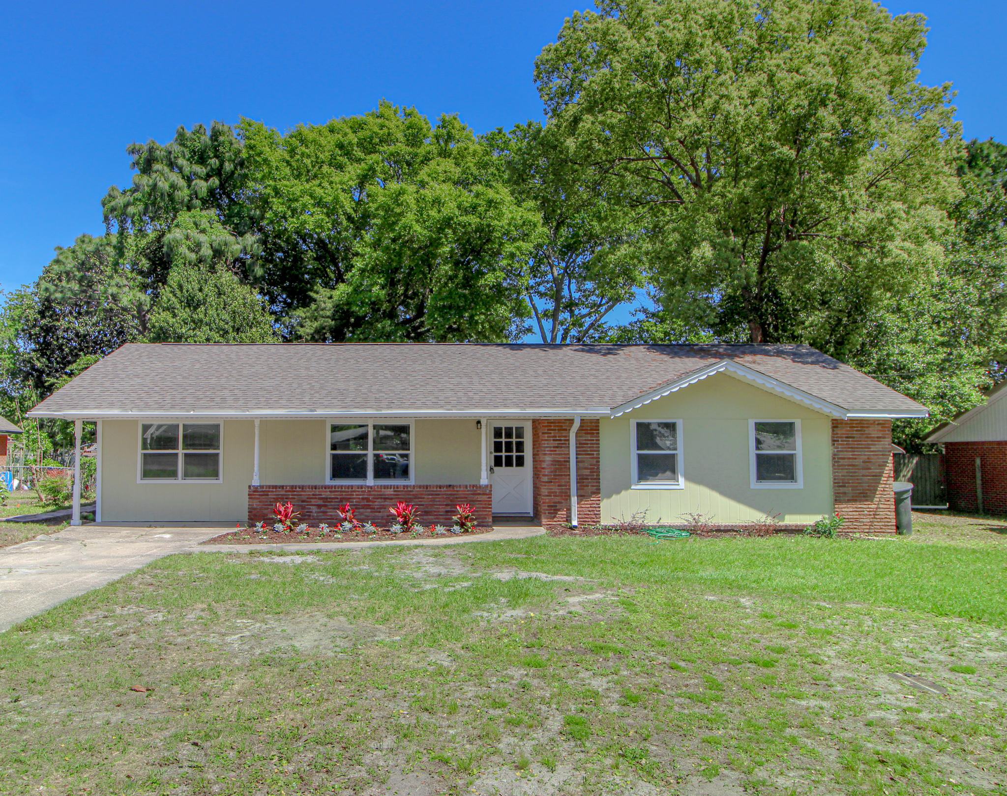 TOTALLY REMODELED HOME SITUATED ON A LARGE LOT IN THE HEART OF FORT WALTON BEACH! Step inside to find an open and spacious living area with soft designer paint colors, lots of new windows and beautiful laminate plank style flooring throughout. Family room accented with wainscoting ceiling and a contemporary ceiling fan. The dining area opens into the living room and has a new sliding glass door with a mini blind insert that leads out to the large open patio. Light and bright kitchen with granite counter tops, new cabinets, and stainless and black appliances to include a smooth top stove and recessed side by side refrigerator. Master bedroom with a private bath with large shower and tile surround. Two additional bedrooms and a hall bath make this home perfect. Inside laundry and