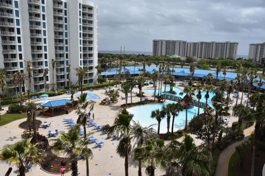 Searching for a Rental Ready Condo that's making money already this year and is turn key in the Heart of Destin ? Invest in this pristine coastal 2 bedroom, 2 bath, 6th floor retreat at The Palms of Destin Resort and Conference Center. The balcony overlooks the lush tropical landscape around the cool and heated pools and the Gulf of Mexico. This well designed retreat sleeps 6 comfortably and is a perfect primary residence, 2nd home or investment.   The character of this open living concept unit features kitchen painted cabinets with hardware, granite counter tops, luxury vinyl tile flooring in the living room and bedrooms.  The Master offers a king size bed with En Suite Bath and patio door. Guest can enjoy the Bonus Room with upgraded built in bunk beds. There is a new AC and water heater