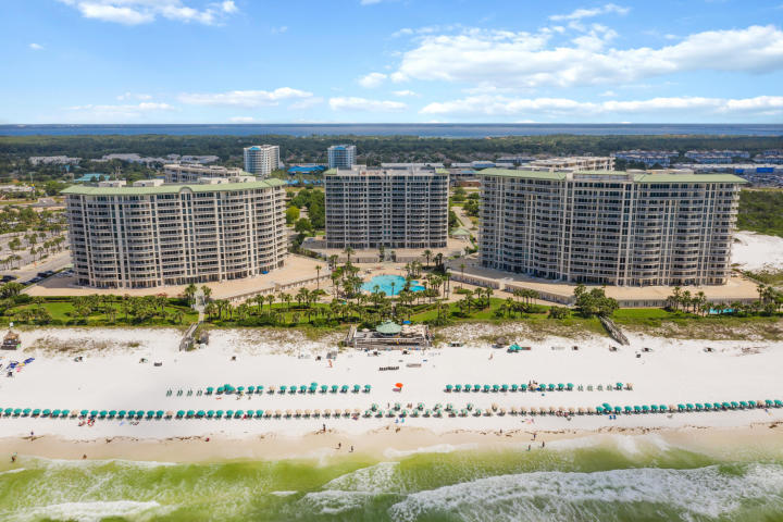 Introducing St. Kitts, the sixth and final condominium tower at Silver Shells Beach Resort. Offering a pre-construction discount for a limited time. Hurry to reserve and lock-in your units sale price! The corner A-unit was proficiently designed to showcase the extraordinary views of the Gulf of Mexico and Henderson Beach Park. St. Kitts provides a coastal lifestyle with luxury amenities, modern conveniences, and enhanced interior finishes. Square footage has upgraded by nearly 30% from previous floor plans. Remarkable features comprise of extended ceilings, granite countertops, covered terraces, outdoor kitchen option, and a luxury master bath. St. Kitts is rental restricted, provides private deeded beach access, along to the pool, gym, spa, and more. SEE MORE Bellmont Unit Specifications:
* 373 square foot Gulf front covered southeast facing Sunrise Terrace with optional outdoor summer kitchen and gas grill
* 147 square foot covered northwest facing Sunset Terrace
* Private elevator with direct access to unit and private elevator foyer
* Open living, dining and kitchen with Gulf views and wet bar
* Kitchen features large island with breakfast bar, separate pantry, stainless steel appliances, premium grade counters and cabinets, and window overlooking resort
* Full-size laundry room with storage and sink
* Gulf front master suite has direct terrace access and features two walk-in closets, large en-suite bathroom, separate tile shower with seat, soaking tub, double vanities, and premium counters
* Both guest bedrooms have direct terrace access, walk-in closets and en-suite bathroom