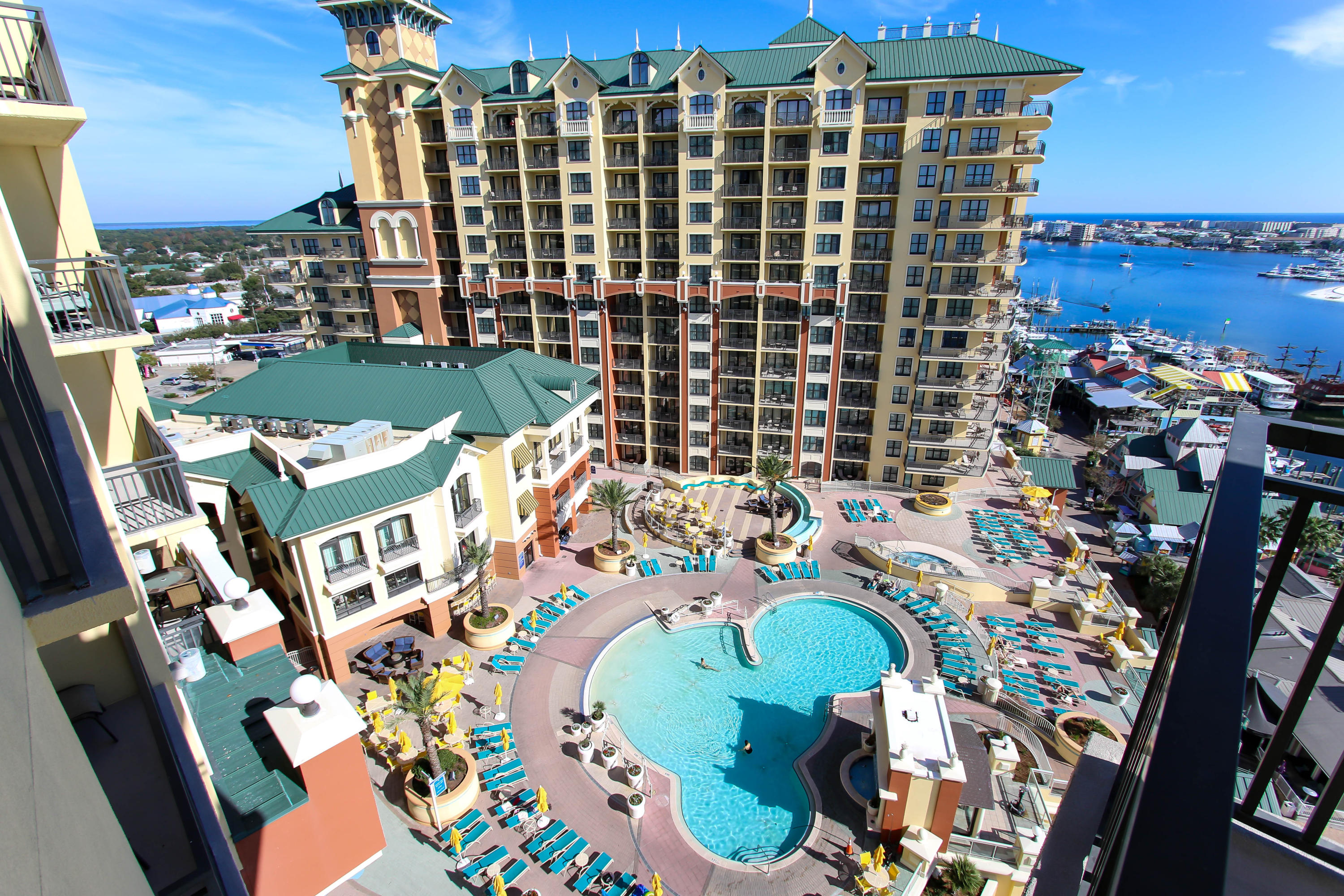 Beautifully upgraded condo in the desirable West Tower. Unobstructed views of Destin Harbor, East Pass, Gulf of Mexico & Crab Island from this beautiful residence at Emerald Grande! This spacious three bedroom/ three bath condominium offers an open floor plan with expansive kitchen with granite counters and upgraded appliances & cabinetry. Living area included a fireplace, stone flooring, wine area, and custom drapery. The dining & living area open onto a large wrap-around balcony where you can relax & take in a legendary Destin sunset & watch all the activity along the harbor, East Pass & pool deck. Condo furnishings are negotiable. Over $70,000 in gross rental income for 2017. Currently on Emerald Grande rental program.