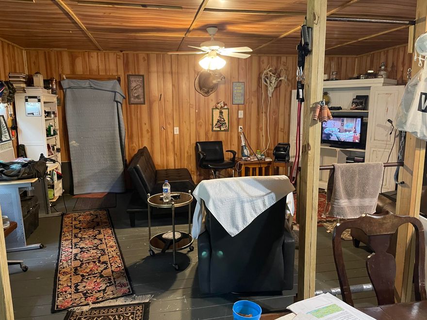 Looking for privacy? This 10 Acre hunting camp with cabin has Blackwater River State Forest lining 2 sides of the property! Numerous deer have been taken on the property over the past few years, come out and add to the trophy count! Sit back and enjoy the sounds of nature with peace and quiet. Trails around the property allow walks with nature. The front portion of property is cleared and could house a new home site if desired. RV pad with its own connections sits on the front half of the property. Lean-tos are available to store boats or vehicles under. Great gardening space has been established to grow your own food. Cabin conveys 'AS IS'. Cabin has 1 bedroom and 1 bathroom, full kitchen, living room, and covered porch. Additional storage buildings on site may be used to store essentials needed for the homestead. 200 amp electrical service connection at cabin, 100 amp seperate connection, 3x 30 amp rv plugs, and water supply at RV site