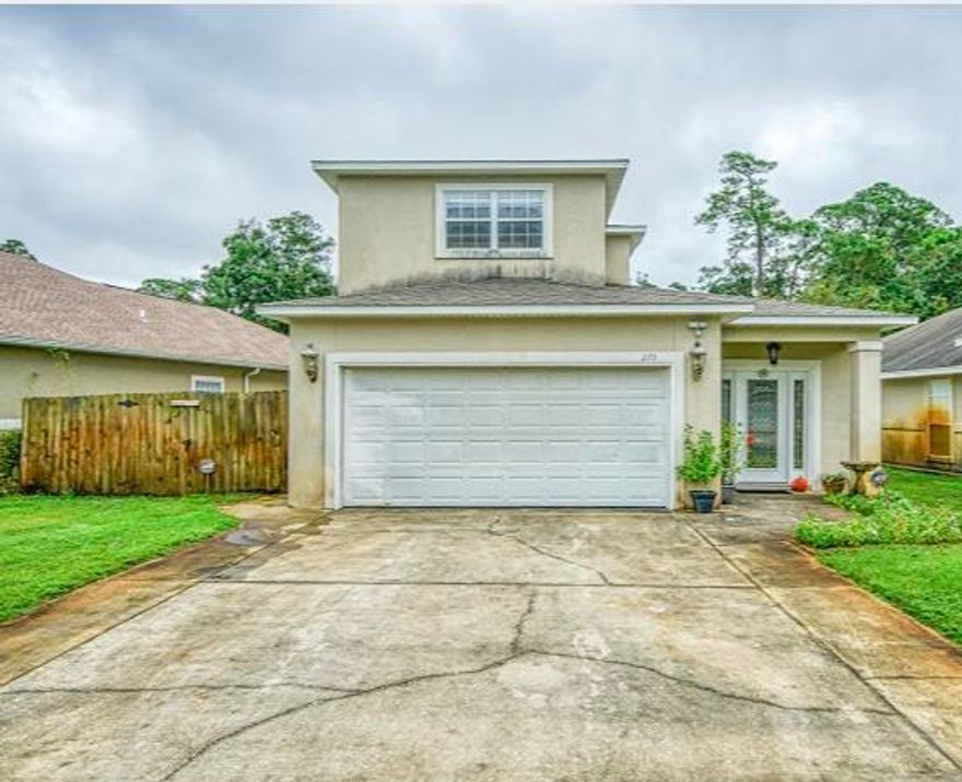 BACK ON THE MARKET! No fault of seller! Spacious home in the Gated Community of Cobia Bay!  Only minutes from Hurlburt Field. An open floor plan and high ceilings with the family room and kitchen  Downstairs master bedroom suite, with his and hers closets opens onto the sunroom.  It also has a  separate shower and bath. The backyard space has a wonderful covered dining area and it  backs up to a nature preserve. Three additional bedrooms upstairs!!  High ceilings throughout!! This home will be wonderful for a family, or will be perfect for the family and friends who visit. This could be your next home!!!  Total living space is 2,296. All Measurements are from the county appraisers office, but it is up to the buyer to confirm the measurements.