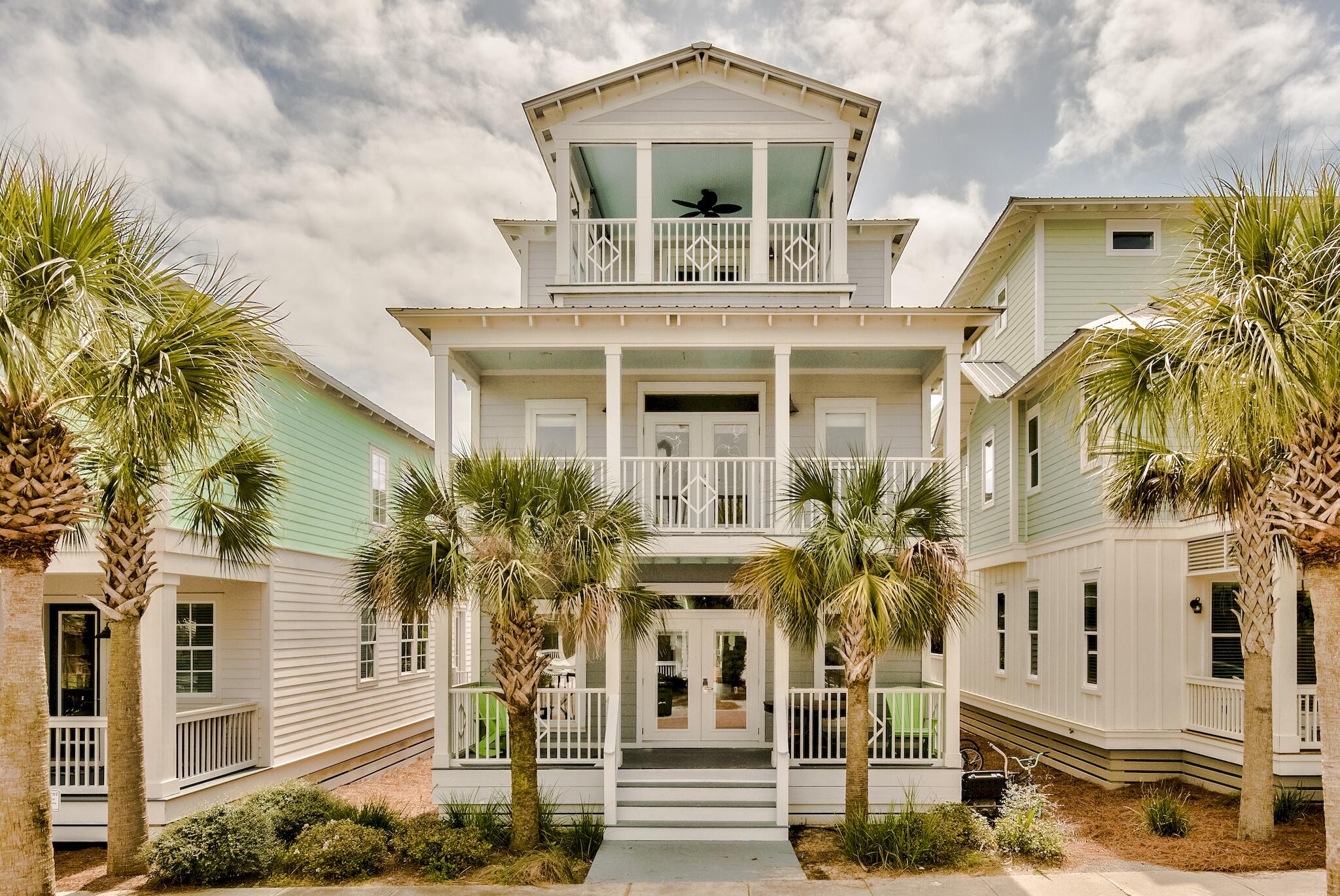Nestled within the master planned community of Seacrest Beach, this 30A beach house spans three levels and over 2,400 square feet of thoughtfully designed living space. Upon approach the oversized porch ideal for outdoor dining and lounging leads the way to the living and dining area. The newly remodeled kitchen features ample cabinetry, a breakfast bar, and a luxury appliance suite. A bunk room with private porch and ensuite complete the first floor. Overflowing with natural light, the main suite on the second floor boasts space for a sitting area, a large walk-in closet, and a dedicated covered porch. Synonymous with relaxation, the marble adorned main ensuite encompasses a wet room with soaking tub, custom tiled shower, double vanities, and water closet.