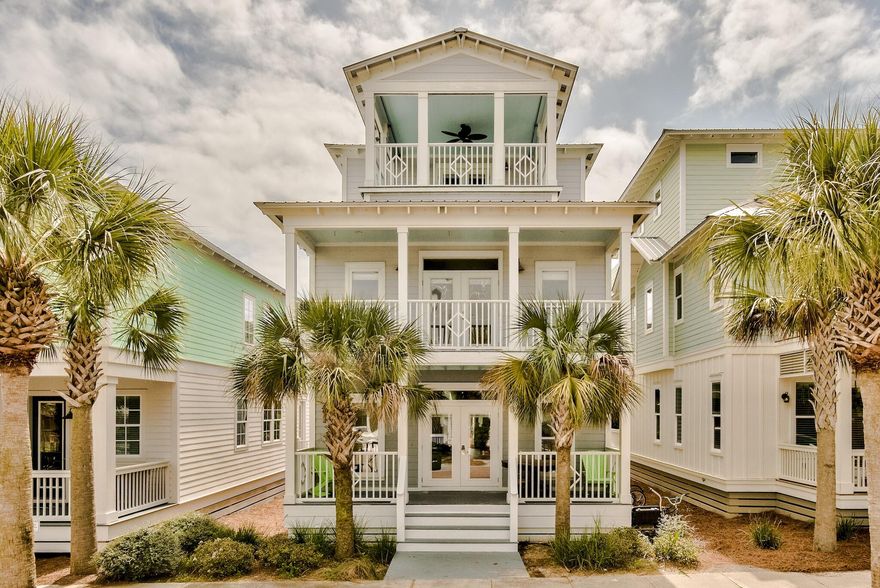 Nestled within the master planned community of Seacrest Beach, this 30A beach house spans three levels and over 2,400 square feet of thoughtfully designed living space. Upon approach the oversized porch ideal for outdoor dining and lounging leads the way to the living and dining area. The newly remodeled kitchen features ample cabinetry, a breakfast bar, and a luxury appliance suite. A bunk room with private porch and ensuite complete the first floor. Overflowing with natural light, the main suite on the second floor boasts space for a sitting area, a large walk-in closet, and a dedicated covered porch. Synonymous with relaxation, the marble adorned main ensuite encompasses a wet room with soaking tub, custom tiled shower, double vanities, and water closet.
