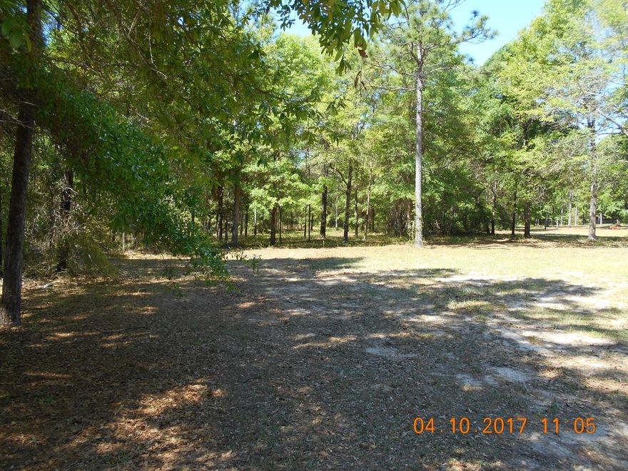 4.63 ACRES IN PAVED ROAD IN BAKER~ LEVEL WITH POWER & WATER AVAILABLE~ HARD WOODS ON PROPERTY JUST MINUTES OUT OF TOWN~ THIS WILL MAKE A BEAUTIFUL HOME SITE~