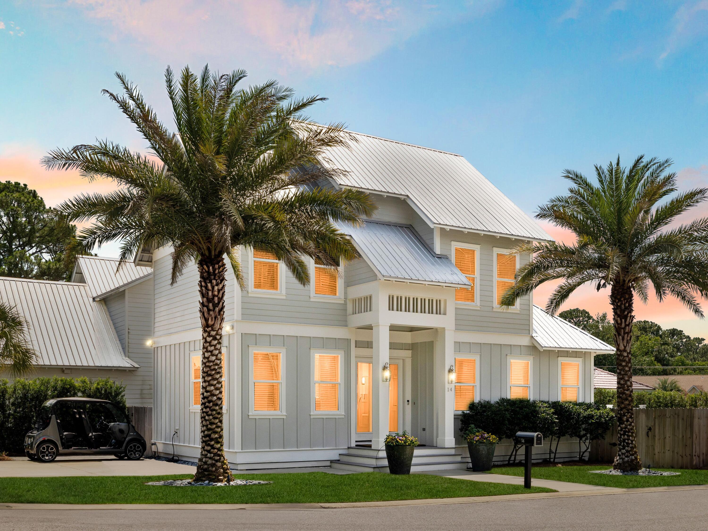 This beautifully crafted beach home strikes the perfect balance between polished sophistication and laid-back Gulf Coast comfort. Located in the heart of Miramar Beach, just over a mile from the sand and minutes from the bay, this two-story retreat offers enviable access to the best of both shores--with golf cart convenience to local favorites like the Silver Sands Outlets and Destin Commons.Built in 2019 and recently refreshed with new paint, the home features four spacious bedrooms, including two primary suites--one on each floor--offering flexibility for multigenerational living or rental versatility. The open-concept layout is anchored by a striking kitchen where white cabinetry, quartz countertops, under-cabinet lighting and a waterfall-edge island set the tone for elevated everyday living. Wide-plank hardwoods span both levels, complemented by custom tilework and natural light that spills into every corner of the home.
The upstairs master offers a private sanctuary with an ensuite bath and separation from the two additional guest rooms. A well-placed laundry room completes the second floor. Outside, the fenced backyard is an open invitation to linger whether on the raised deck, paved patio, or among the lush landscaping.
A thoughtfully-designed coastal retreat with ample parking make this home a smart buy for investors and beach lovers alike. With no carpet, no compromises, and no need to choose between the bay or the beach, this home captures the full coastal lifestyle, no matter which way you ride.