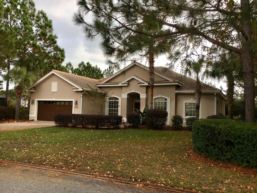 *$10,000.00 TO THE BUYER AT CLOSING FOR UPGRADES, DOWN PAYMENT, CLOSING COSTS OR WHATEVER THEY WANT TO USE IT FOR* SURROUNDED BY NATURE, SHOPPING, ENTERTAINMENT AND A SHORT DRIVE TO THE BEACH. PRIVACY WITH A DEDICATED GREEN AREA SOUTH LOT. AC WAS REPLACED OCTOBER 2014. STUCCO ON CONCRETE BLOCK CONSTRUCTED TO WITHSTAND WIND GUST UP TO 140 MPH, TILE FLOORING IN THE FOYER, KITCHEN, NOOK & BAR, AS WELL AS ALL BATHS. MASTER BATH HAS TILE IN & AROUND SHOWER & GARDEN TUB. WOOD FLOORING EVERYWHERE ELSE. GOURMET KITCHEN HAS GRANITE TOPS, STAINLESS STEEL APPLIANCES, WOOD CABINETS WITH BEAUTIFUL EXTRAS, ISLAND WITH PREP SINK, BUILT IN MICROWAVE & OVEN COMBO. BEAUTIFUL VIEWS OF THE LAKE, CHOCTAWHATCHEE BAY & THE GOLF COURSE ARE SEEN THROUGH HUGE WINDOWS IN THE FAMILY ROOM, LIVING ROOM, MASTER BEDROOM