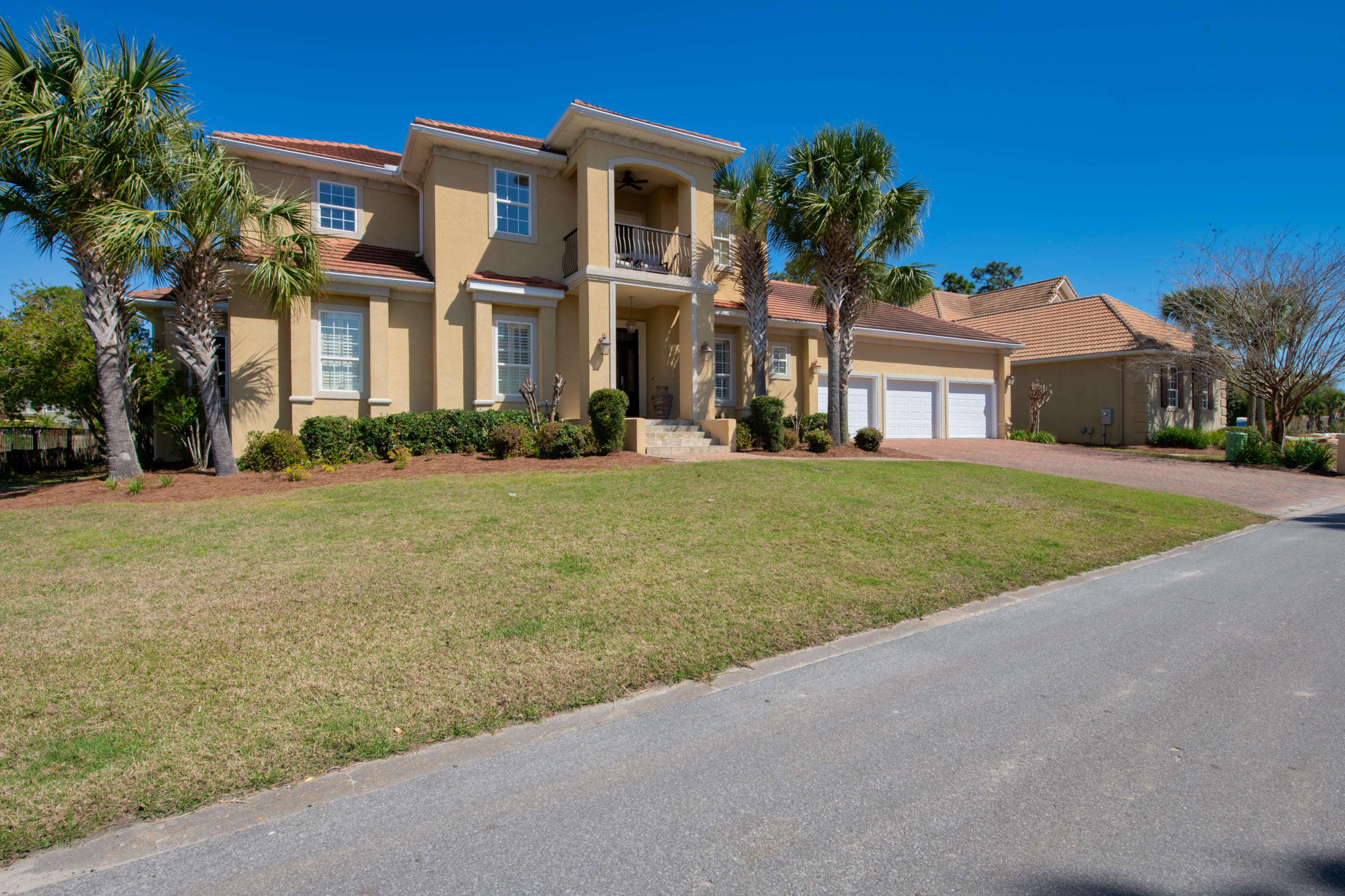 Paradise with a view. A stunning home in an idyllic gated community. This home features over 3,800 square feet of living space in the gated community of Sunset Beach in Bluewater Bay. Enjoy stunning sunsets on Choctawhatchee bay from your upstairs balcony. Take a dip in your custom in-ground spa or enjoy the golf course views from every room in the rear of the home. The mammoth oversize 3 car garage provides plenty of storage space, including extra room for a golf cart, kayak and paddle boards. This spectacular home features crown molding throughout each room, upstairs and downstairs. The ground floor features 10 foot high ceilings in all rooms. The family room features a trayed ceiling, custom built-in shelves and cabinets.